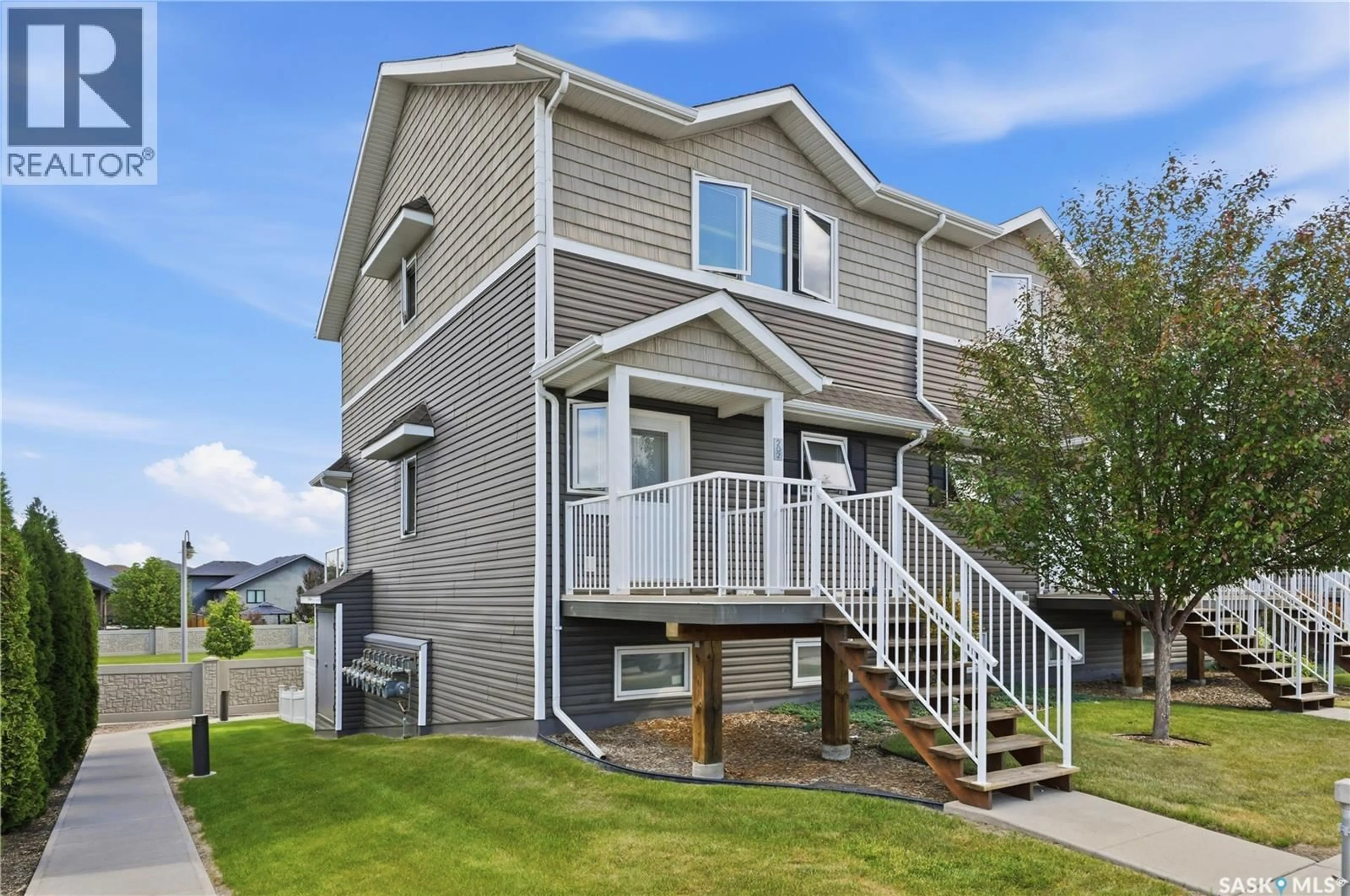 Home with vinyl exterior material, street for 202 275 PRINGLE LANE, Saskatoon Saskatchewan S7T0T5