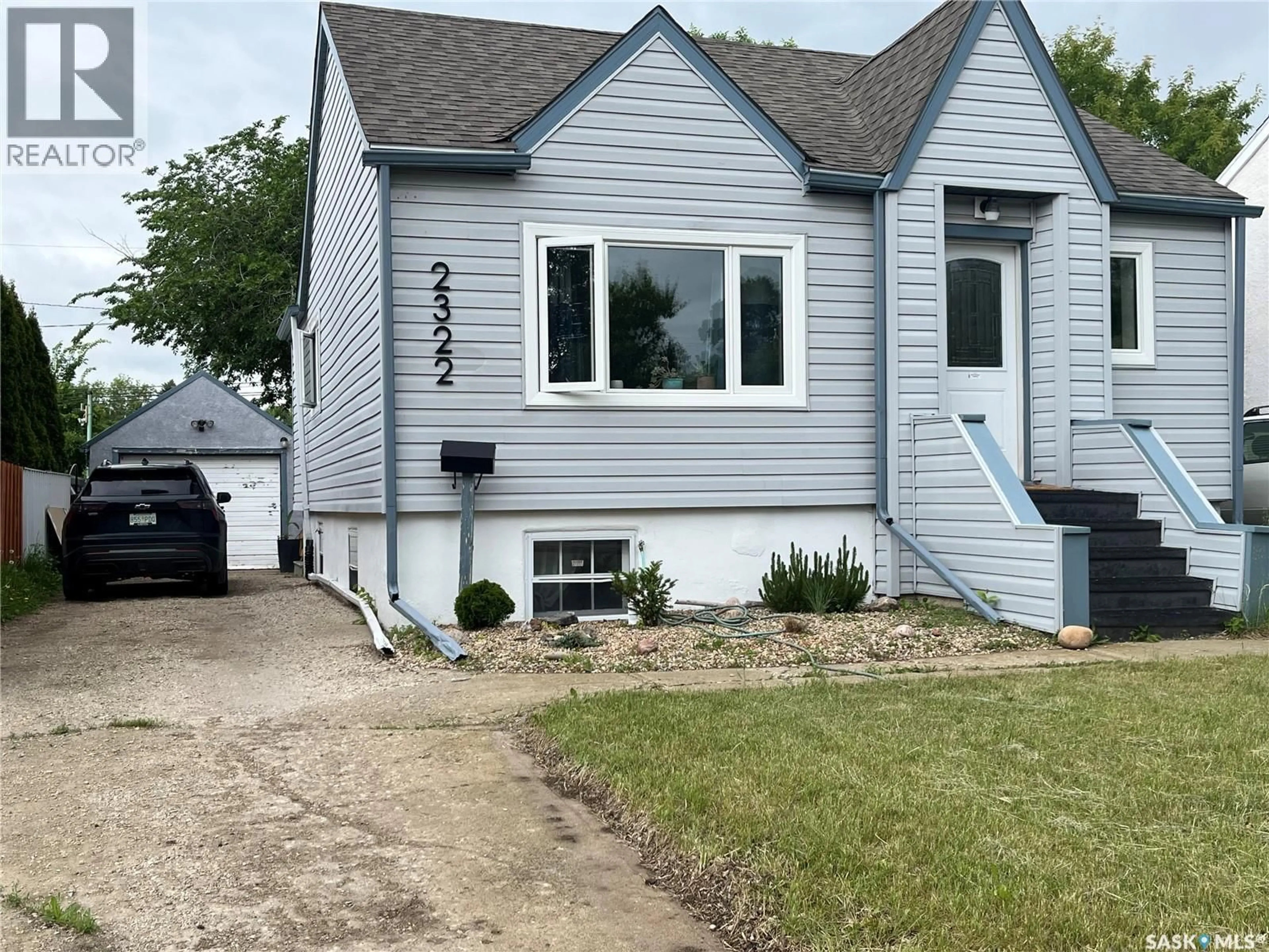 Home with vinyl exterior material, street for 2322 REYNOLDS STREET, Regina Saskatchewan S4N3N5