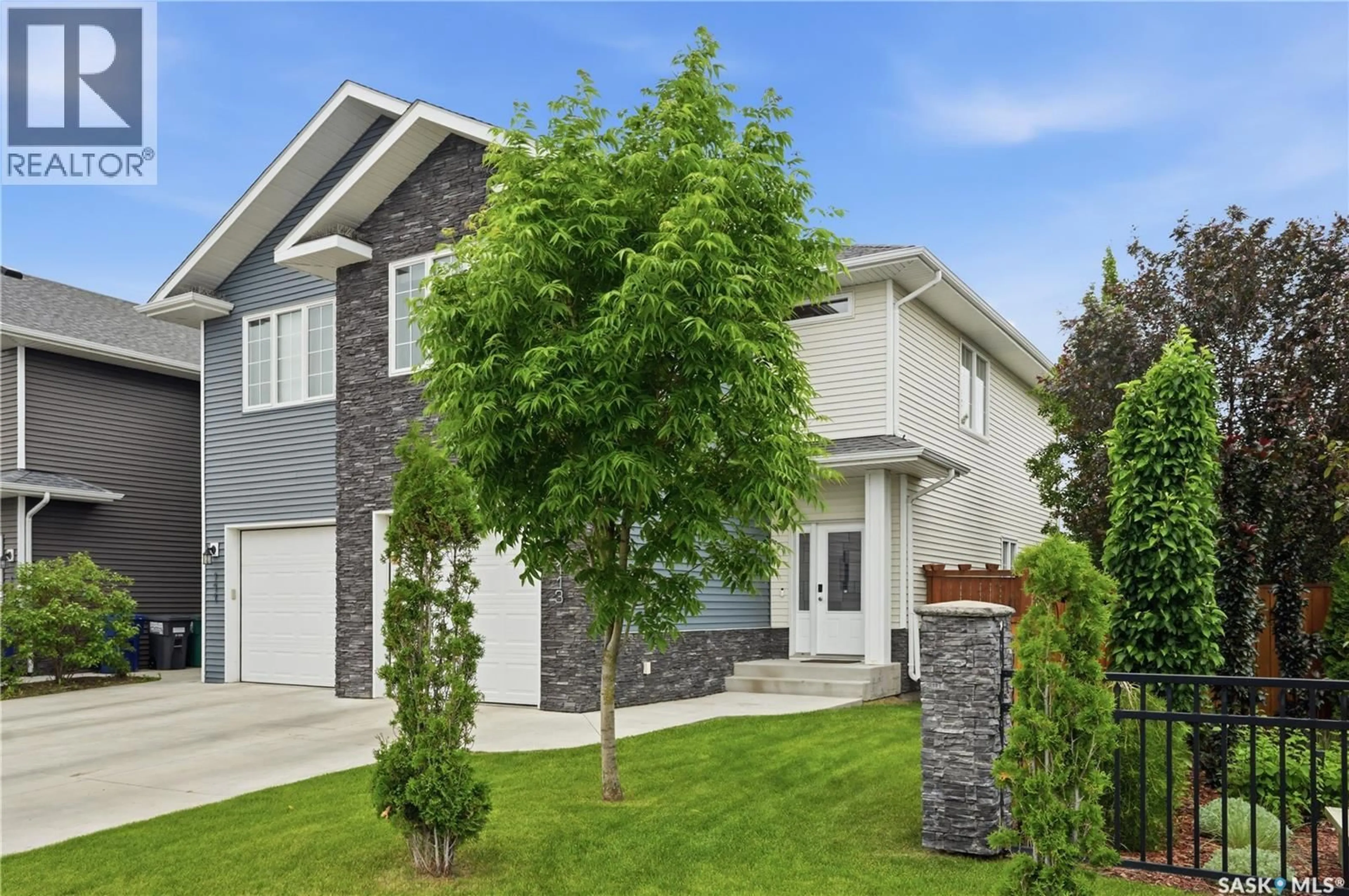 Home with vinyl exterior material, street for 113 SALLOUM CRESCENT, Saskatoon Saskatchewan S7W0V1