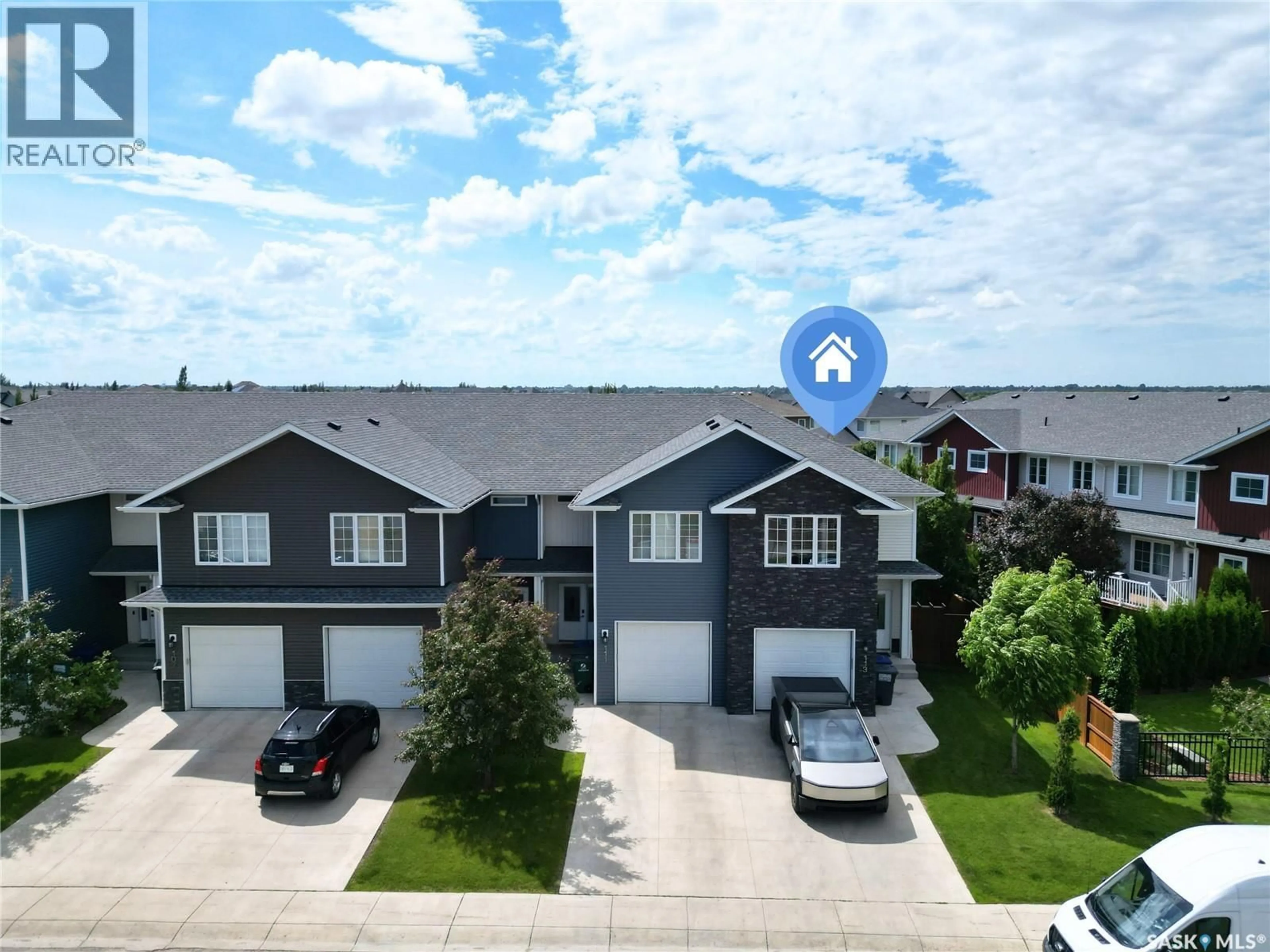 A pic from outside/outdoor area/front of a property/back of a property/a pic from drone, street for 113 SALLOUM CRESCENT, Saskatoon Saskatchewan S7W0V1