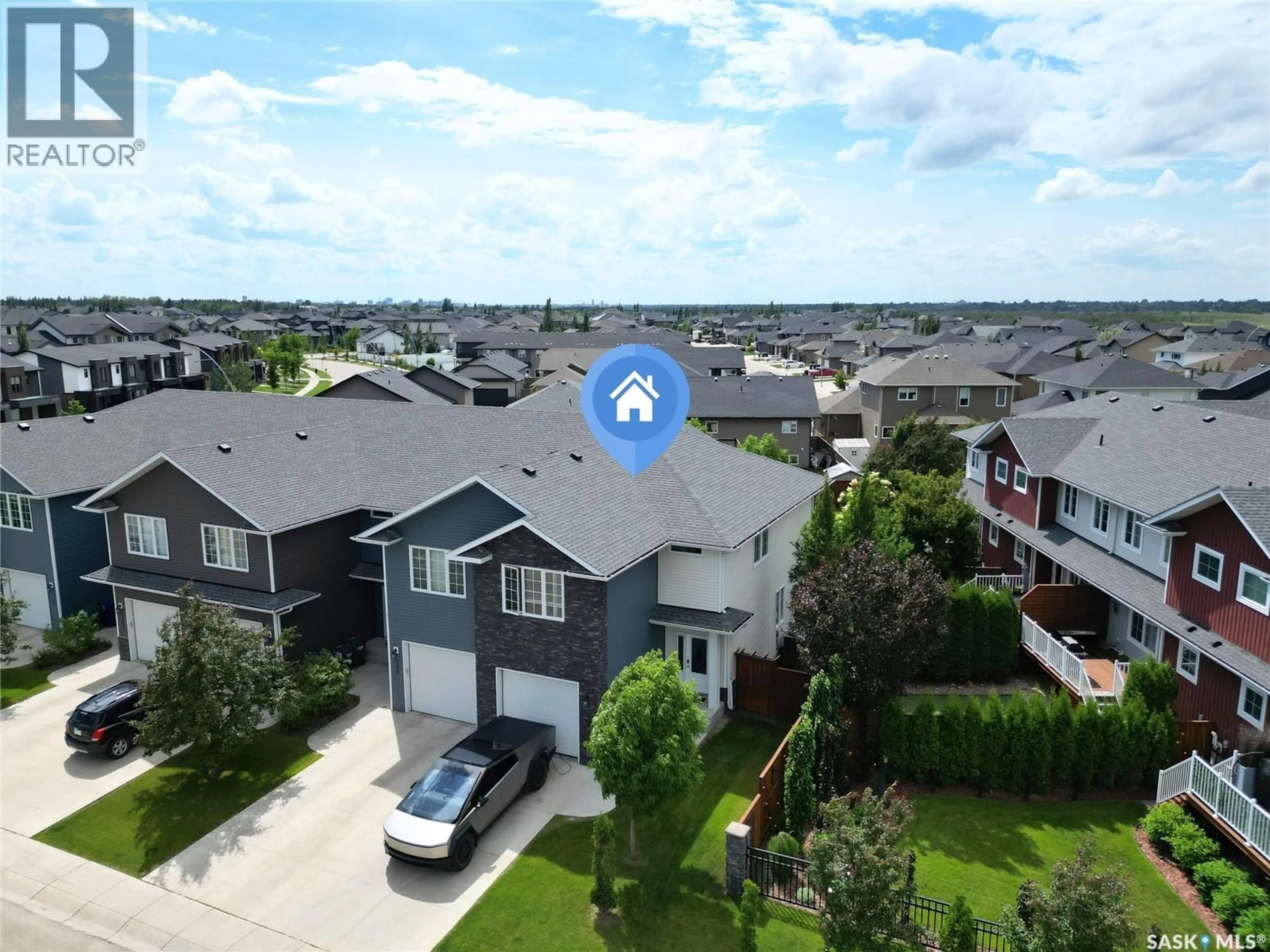 A pic from outside/outdoor area/front of a property/back of a property/a pic from drone, unknown for 113 SALLOUM CRESCENT, Saskatoon Saskatchewan S7W0V1
