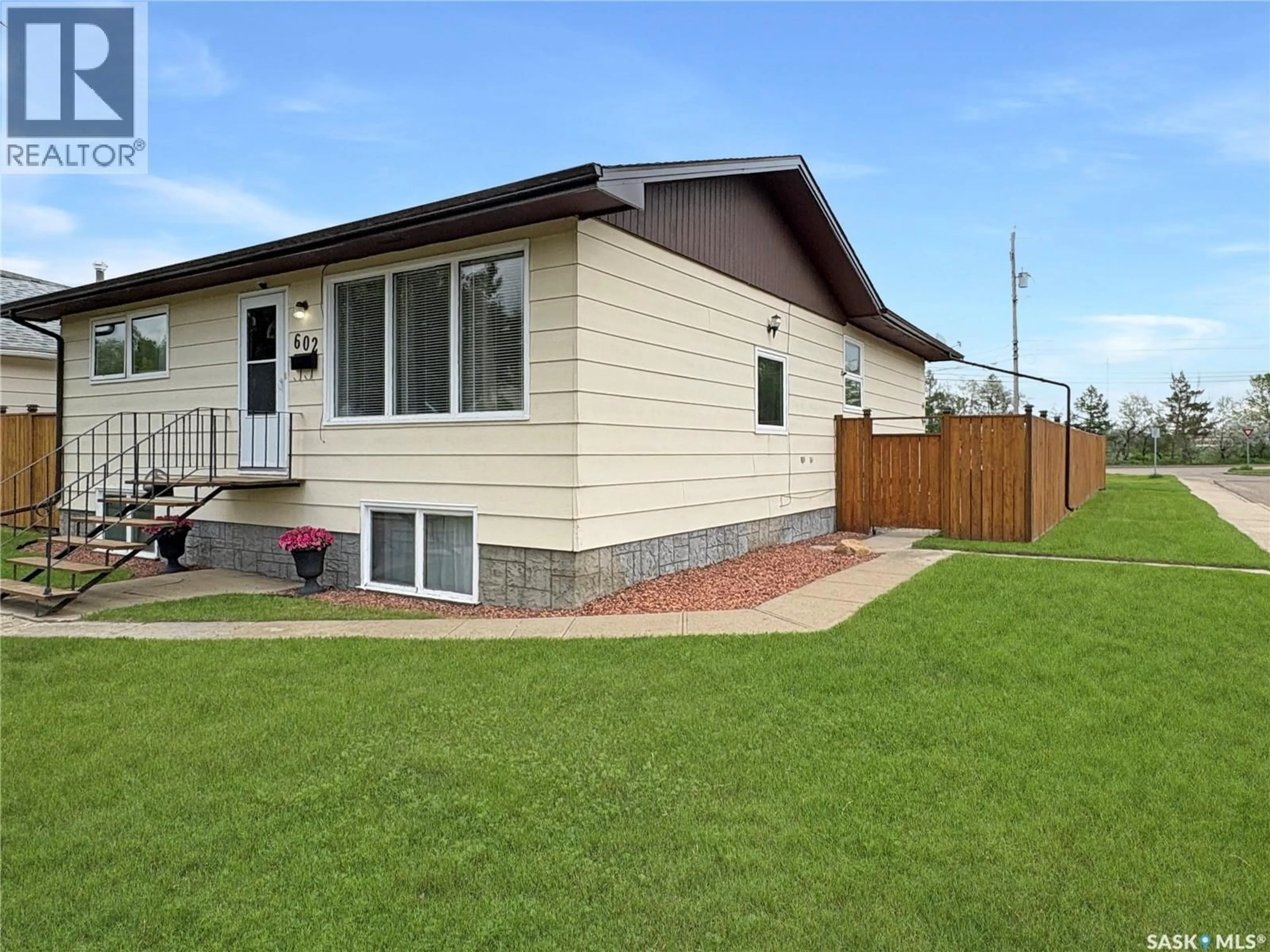 Home with vinyl exterior material, street for 602 104TH STREET, North Battleford Saskatchewan S9A1M8