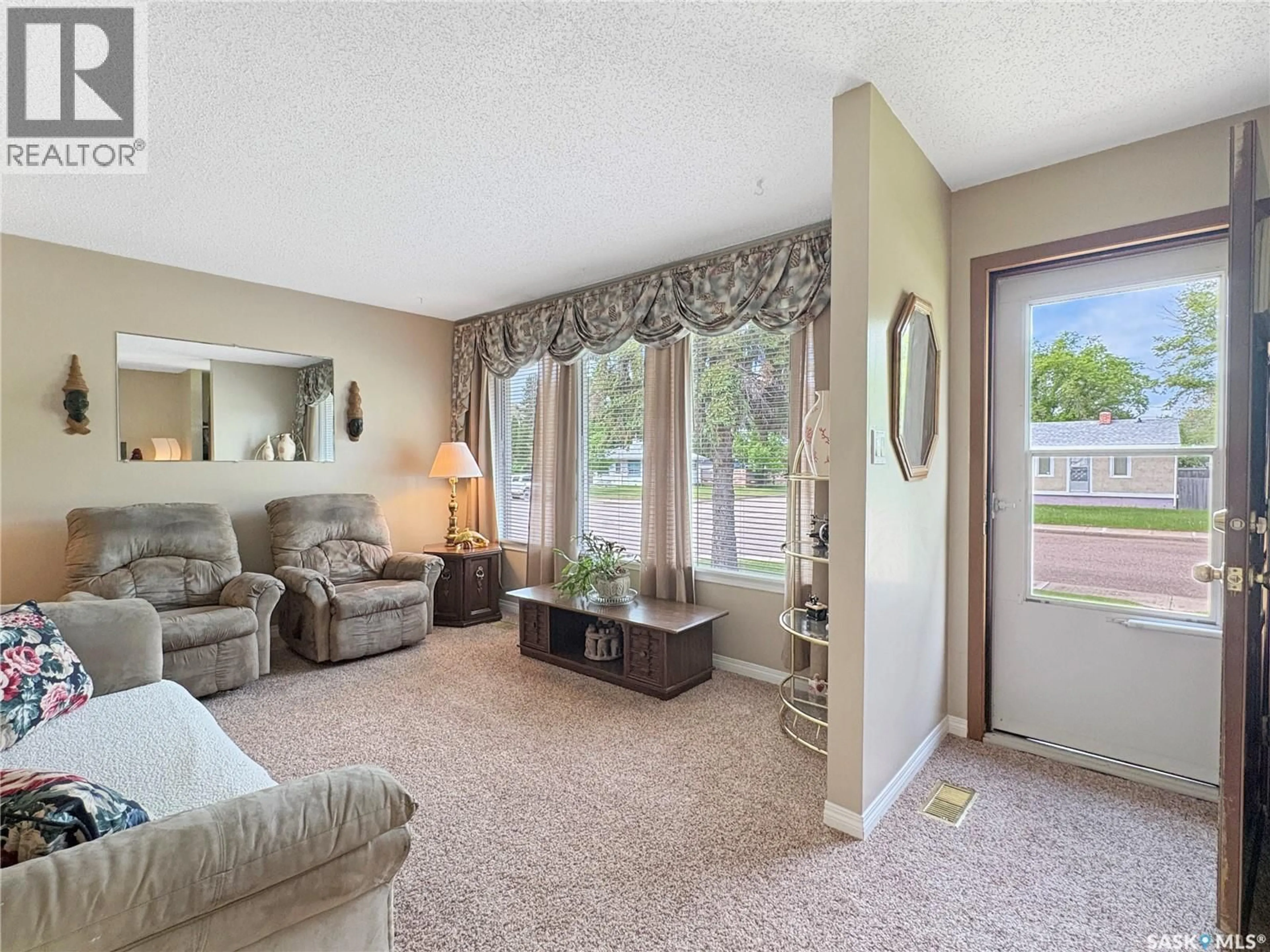 Living room with furniture, carpet floor for 602 104TH STREET, North Battleford Saskatchewan S9A1M8