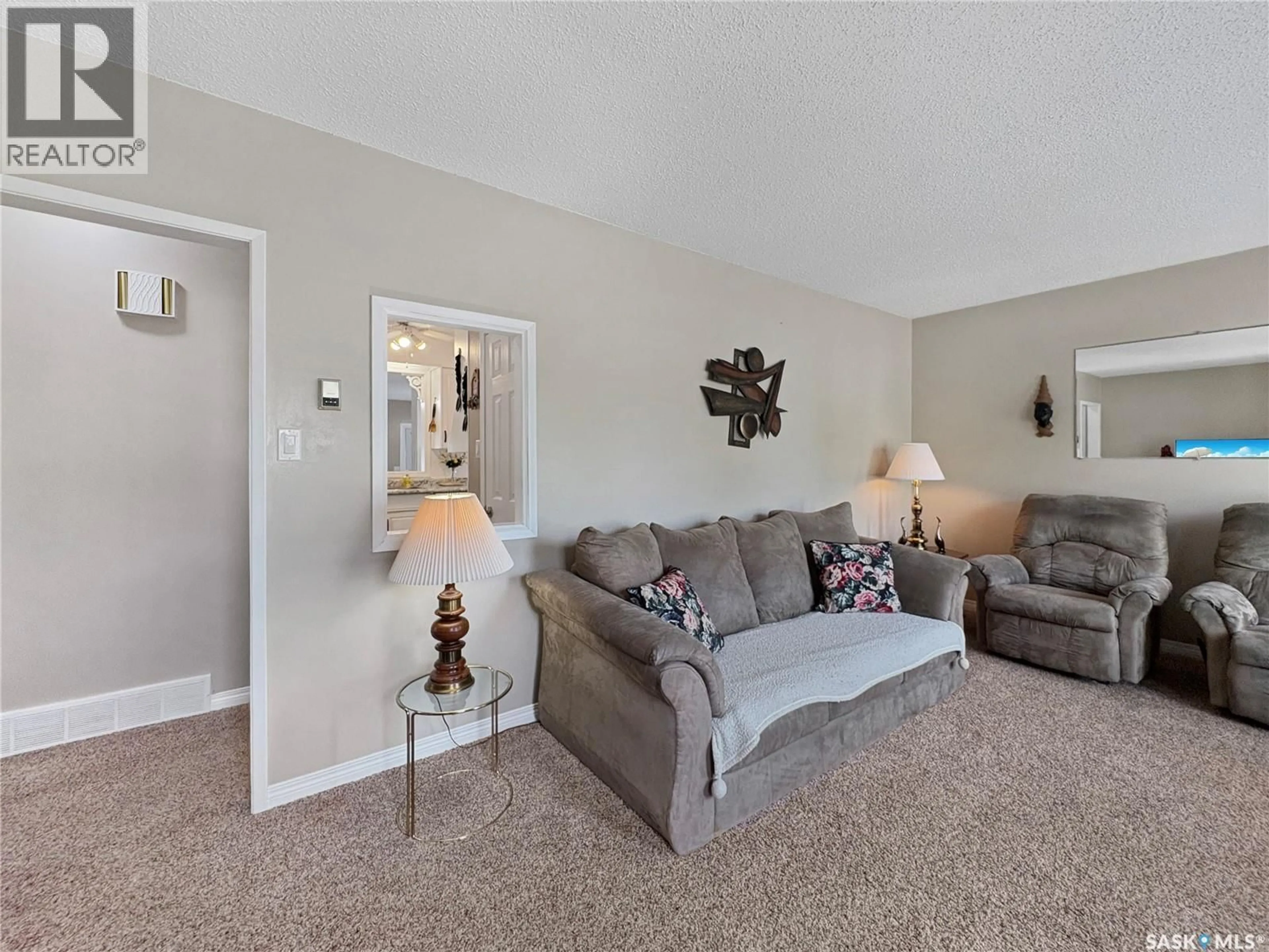 Living room with furniture, carpet floor for 602 104TH STREET, North Battleford Saskatchewan S9A1M8