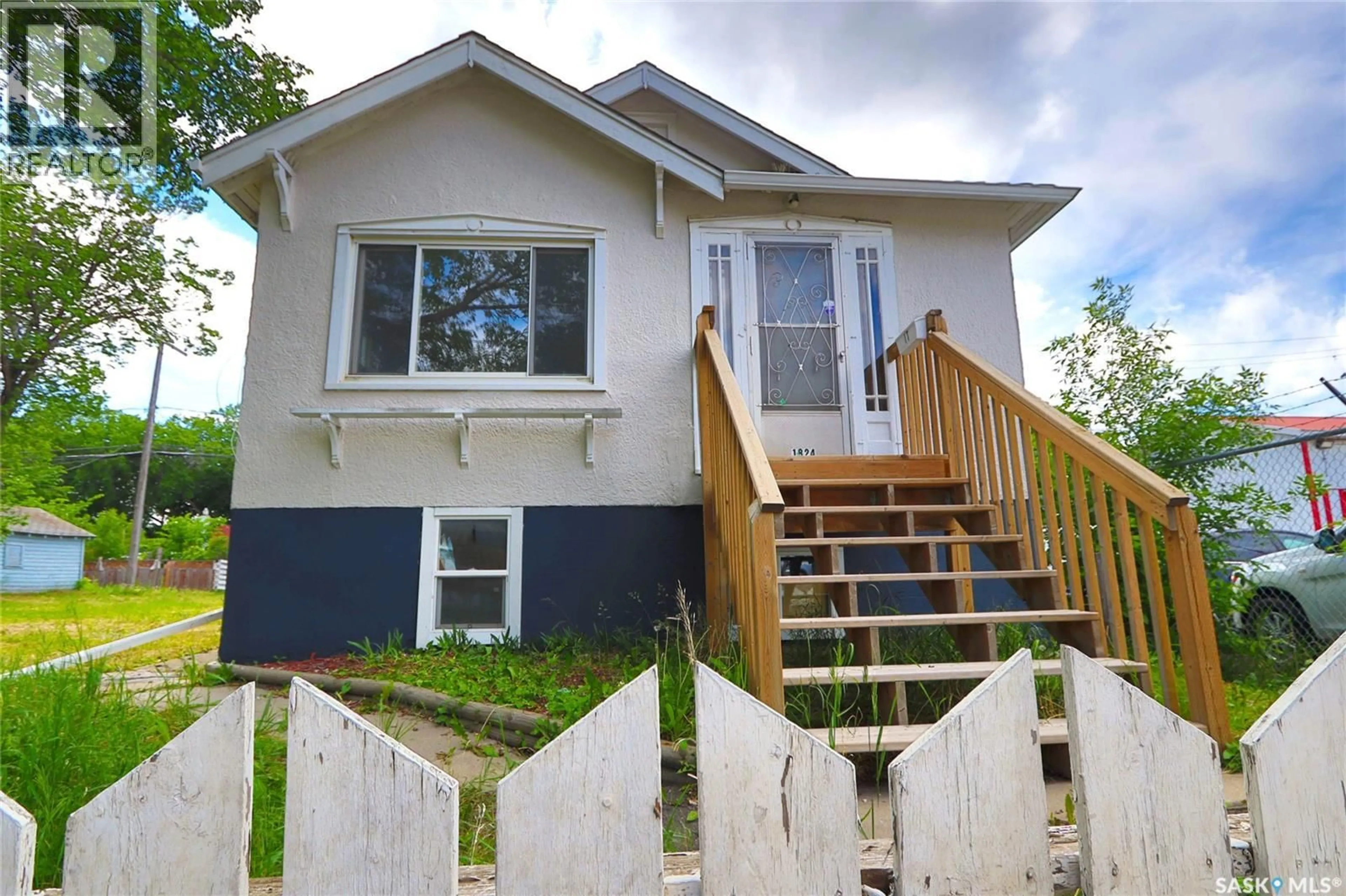 Home with vinyl exterior material, street for A&B - 1824 WINNIPEG STREET, Regina Saskatchewan S4P1G2