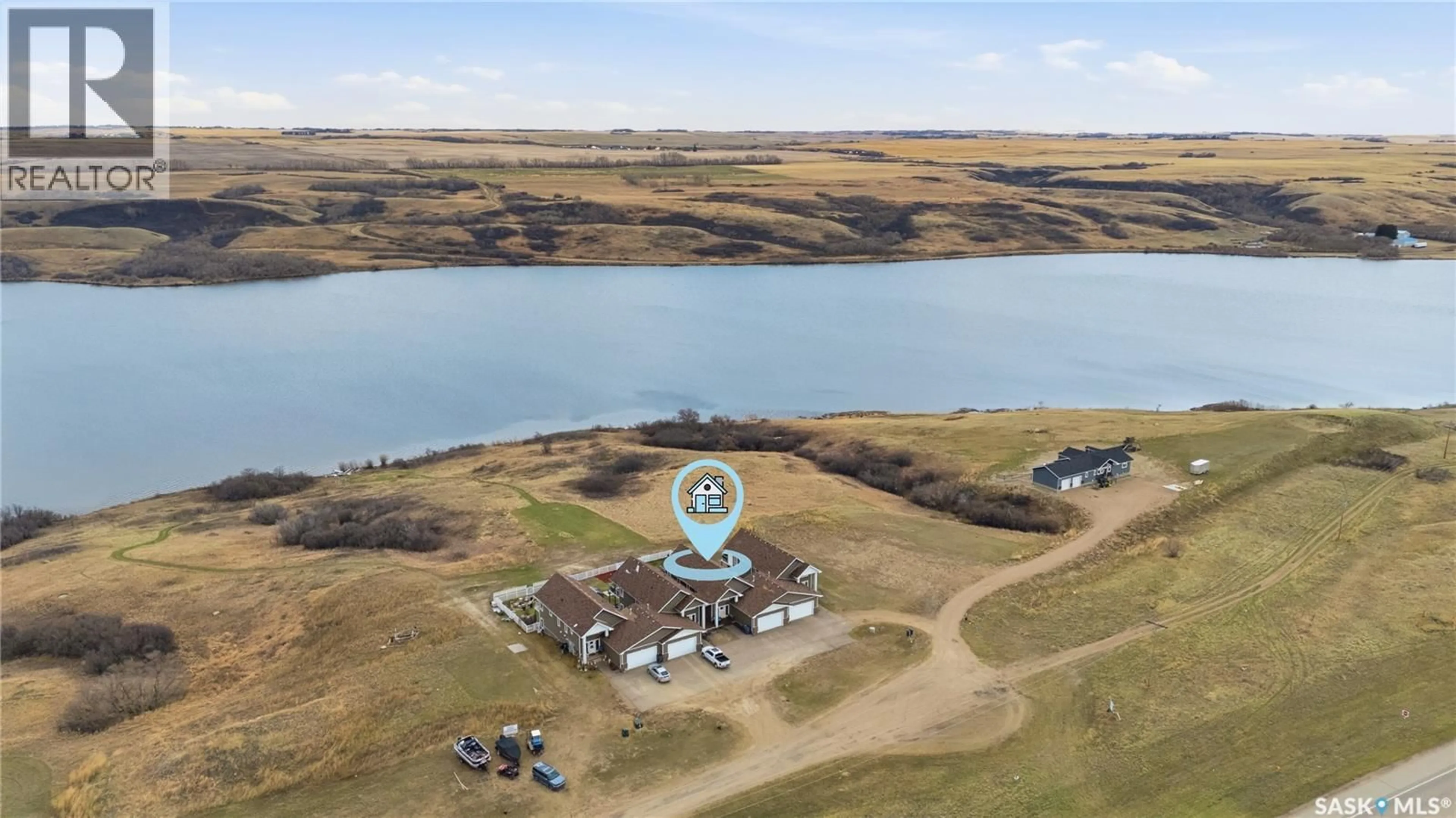 A pic from outside/outdoor area/front of a property/back of a property/a pic from drone, water/lake/river/ocean view for 2 - 125 SUNRISE DRIVE, Blackstrap Reservoir Saskatchewan S7C0A6