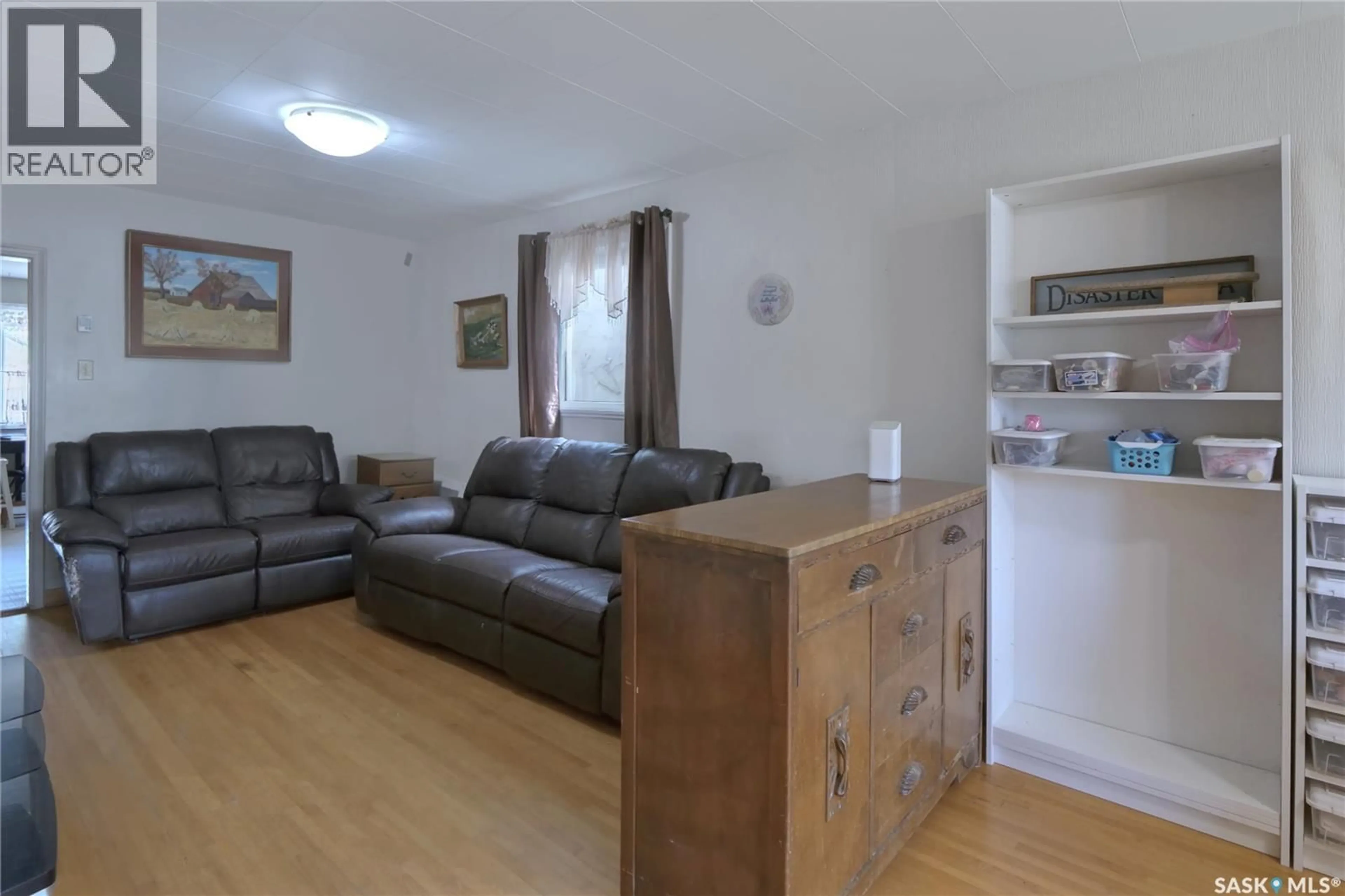 Living room with furniture, wood/laminate floor for 460 IROQUOIS STREET, Moose Jaw Saskatchewan S6H5B3