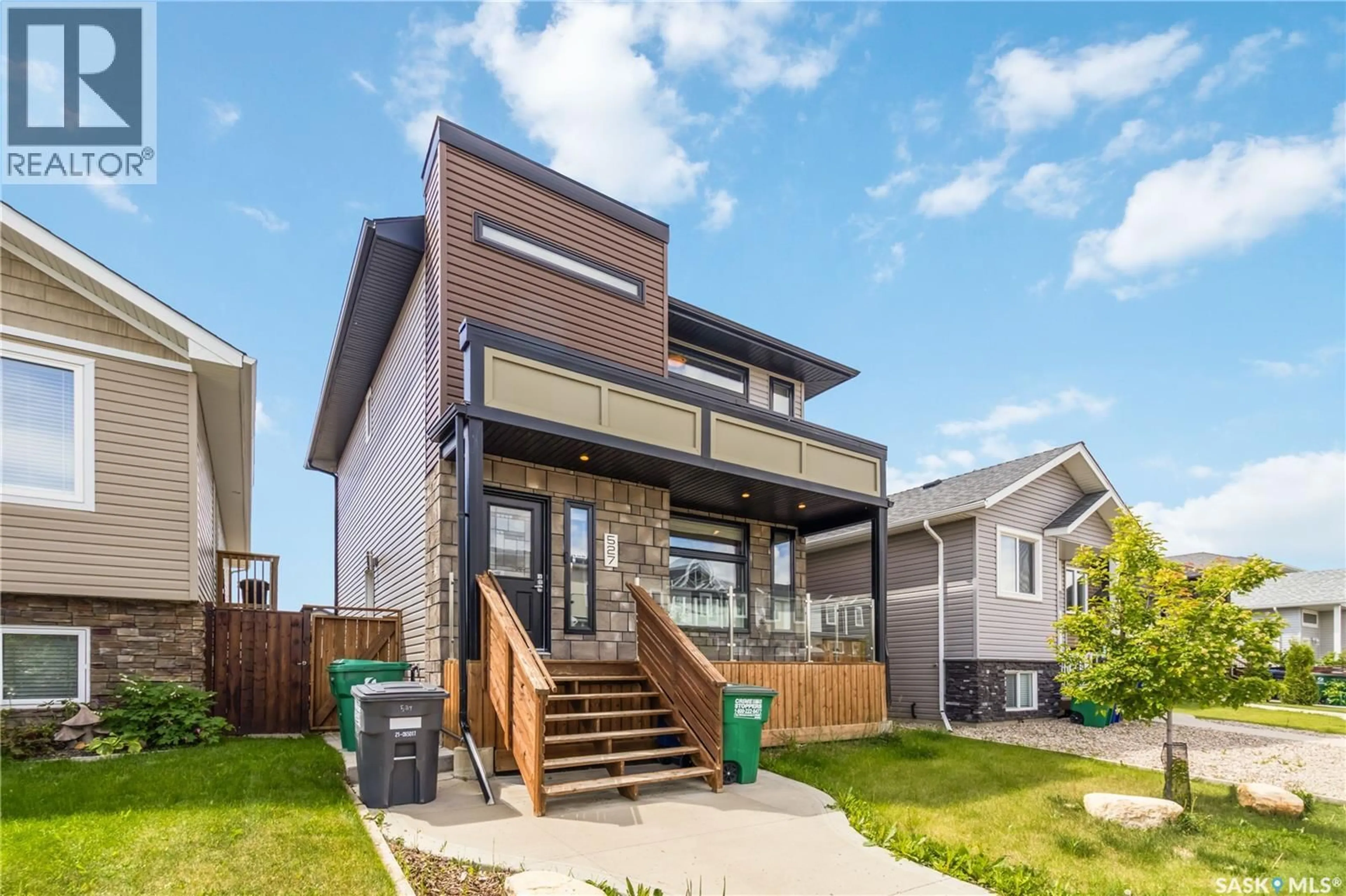 Home with vinyl exterior material, street for 527 KLOPPENBURG CRESCENT, Saskatoon Saskatchewan S7W0P1