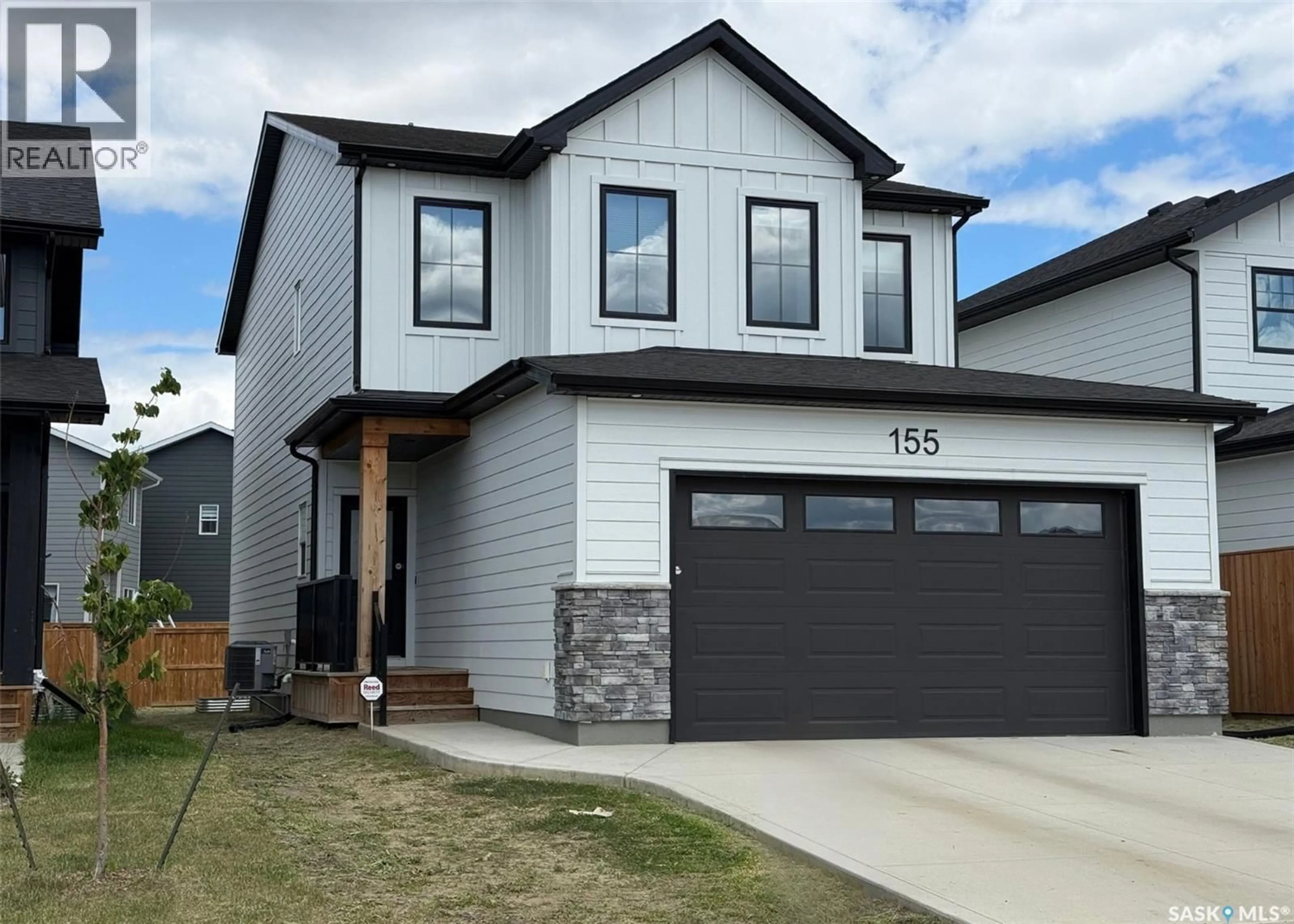 Home with vinyl exterior material, street for 155 KEITH WAY, Saskatoon Saskatchewan S7V0X9