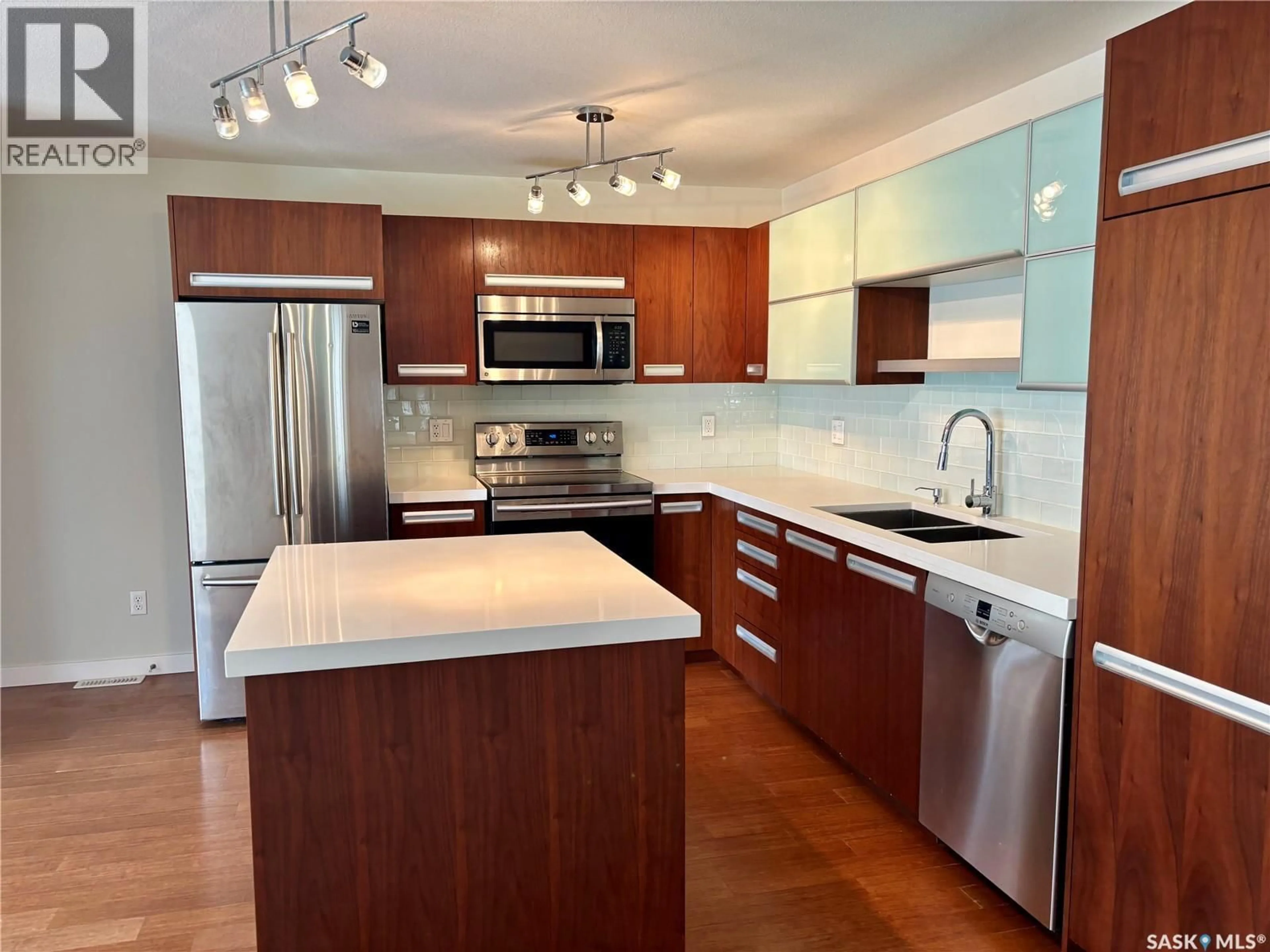 Open concept kitchen, wood/laminate floor for 1015 - 801 PATRICK CRESCENT, Saskatoon Saskatchewan S7W0M4