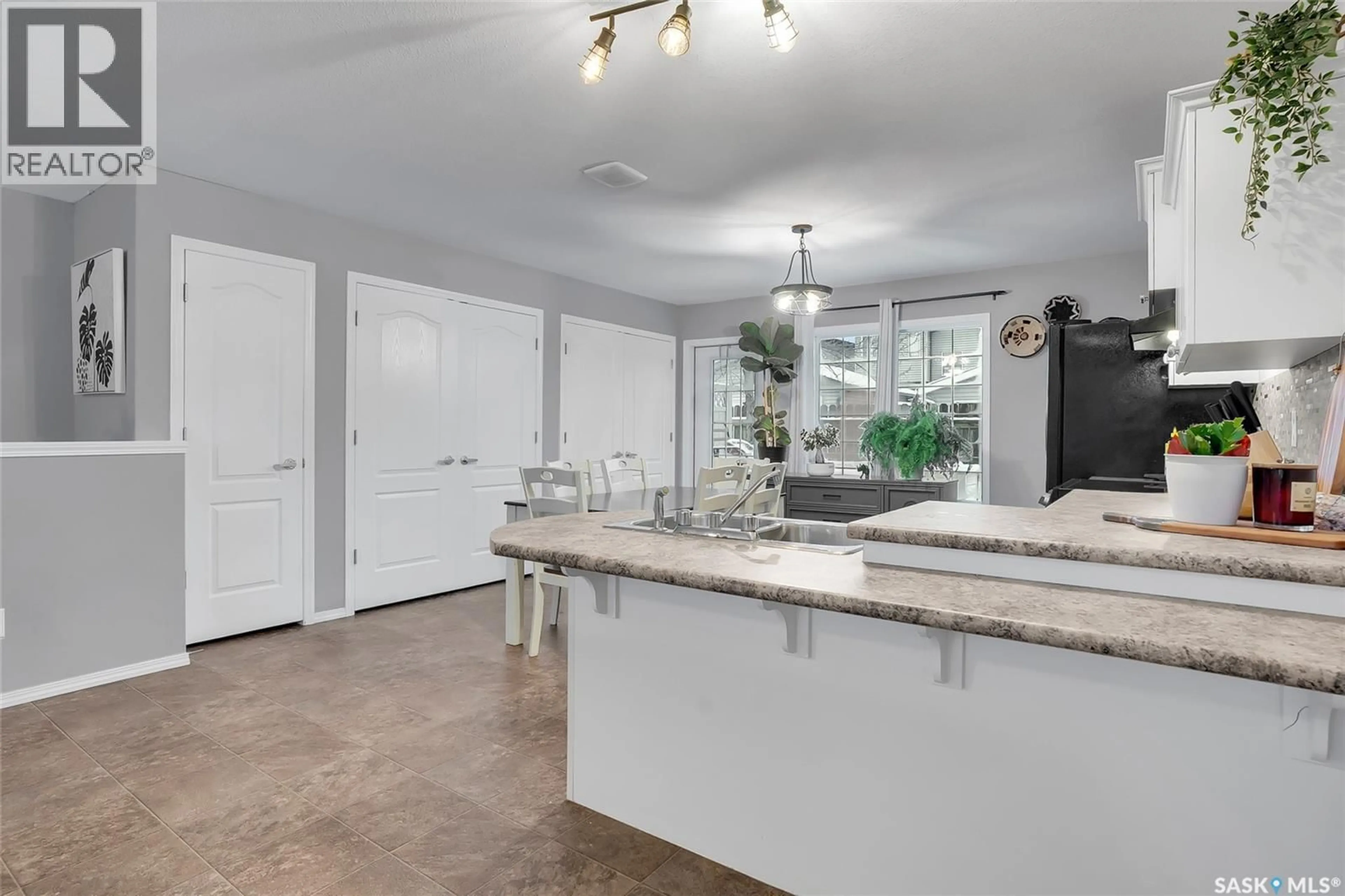 Open concept kitchen, ceramic/tile floor for 12 135 KEEDWELL STREET, Saskatoon Saskatchewan S7W0A3