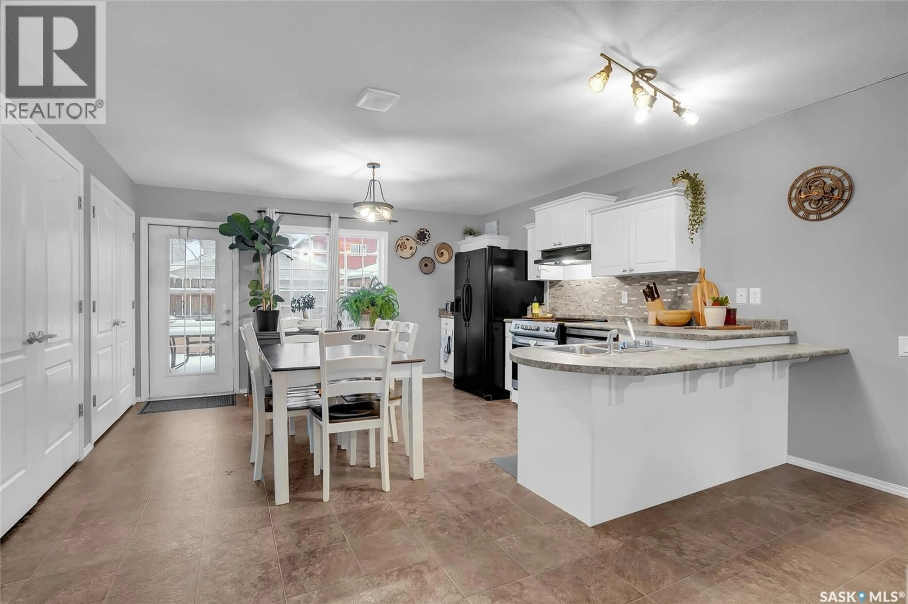 Open concept kitchen, ceramic/tile floor for 12 135 KEEDWELL STREET, Saskatoon Saskatchewan S7W0A3