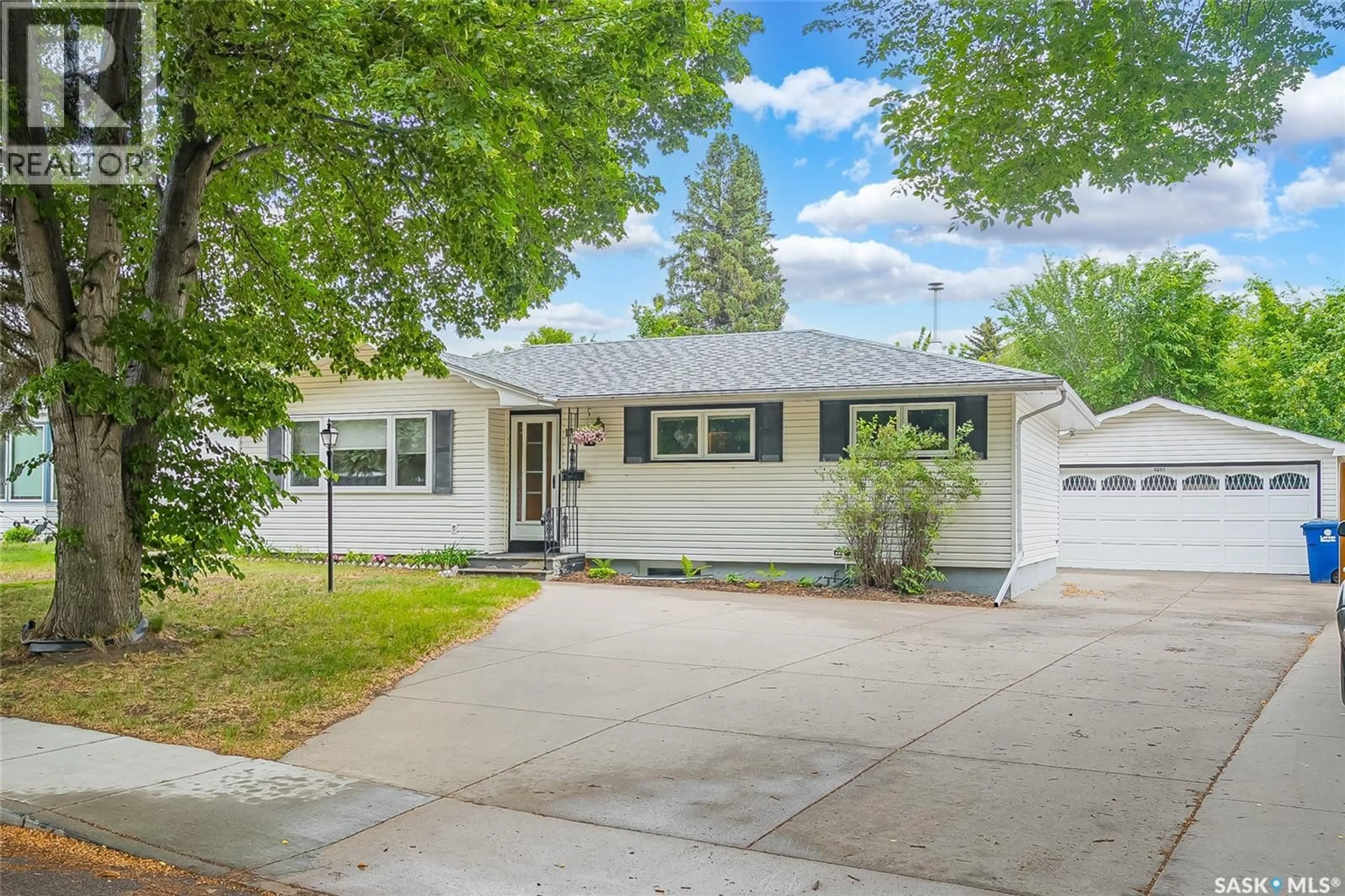 Home with vinyl exterior material, street for 1317 EAST CENTRE, Saskatoon Saskatchewan S7J3A8