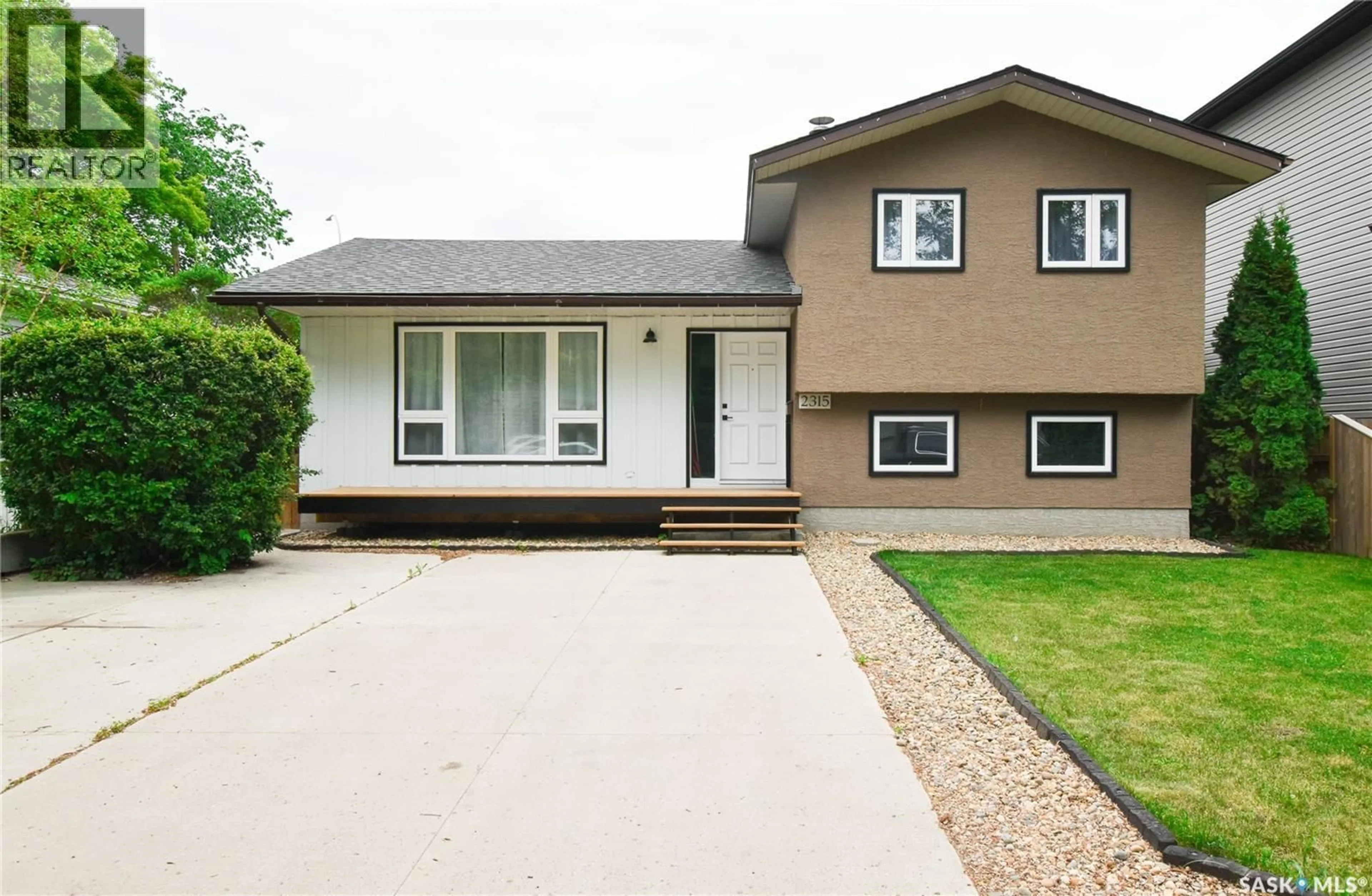 Home with vinyl exterior material, street for 2315 ST GEORGE AVENUE, Saskatoon Saskatchewan S7M0K9