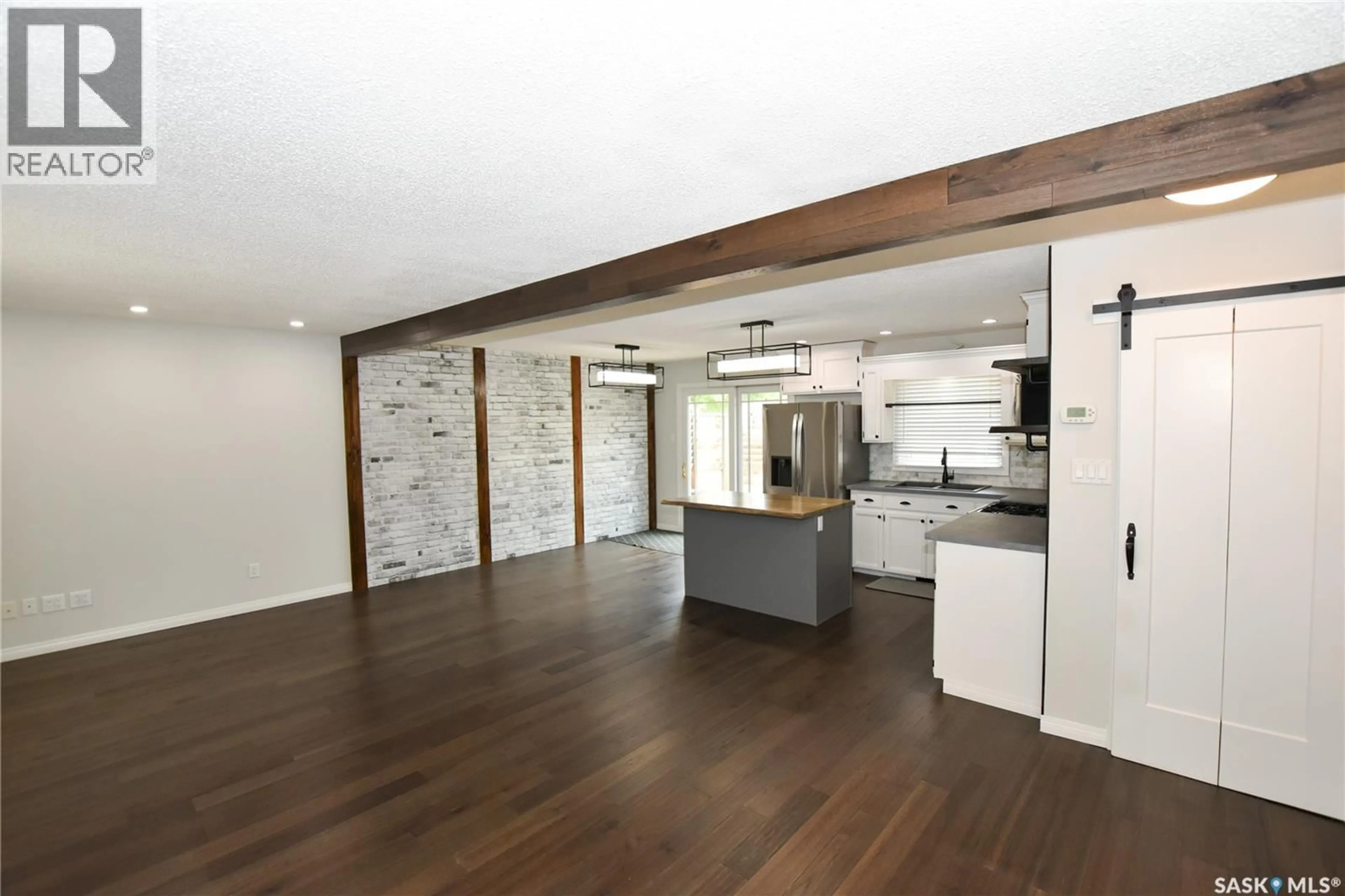 Open concept kitchen, wood/laminate floor for 2315 ST GEORGE AVENUE, Saskatoon Saskatchewan S7M0K9