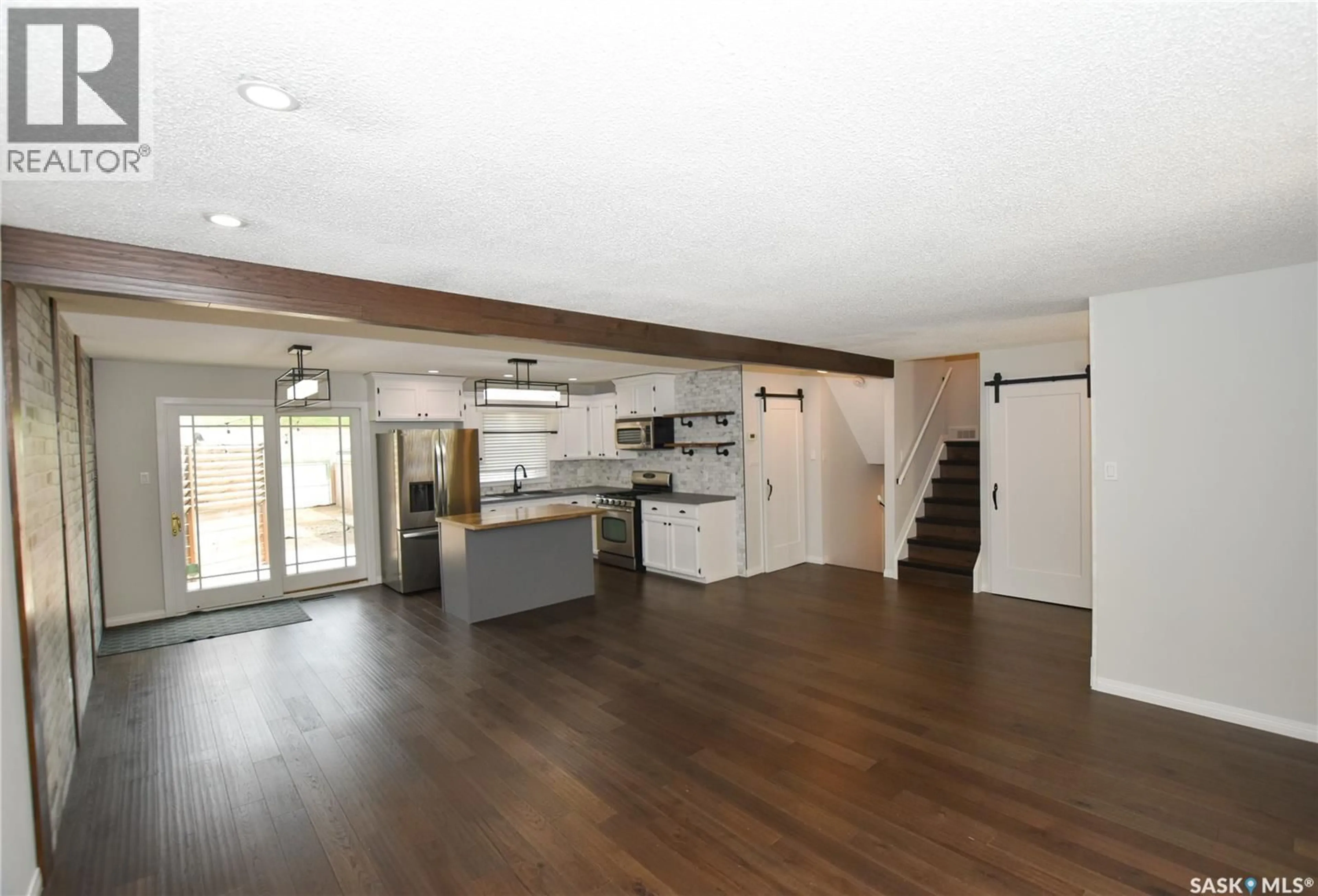 Open concept kitchen, wood/laminate floor for 2315 ST GEORGE AVENUE, Saskatoon Saskatchewan S7M0K9