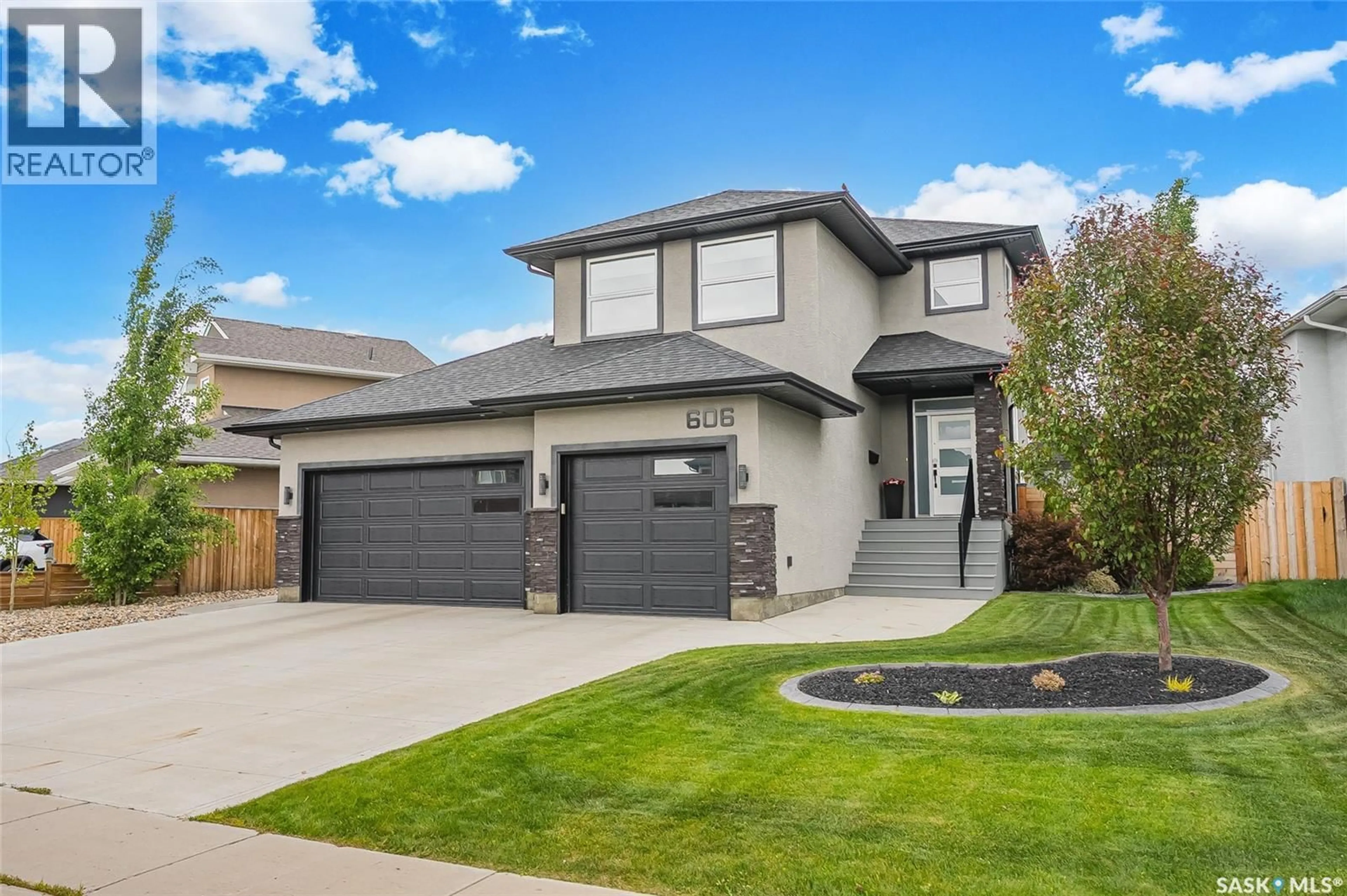 Home with vinyl exterior material, street for 606 PICHLER CRESCENT, Saskatoon Saskatchewan S7V0G2