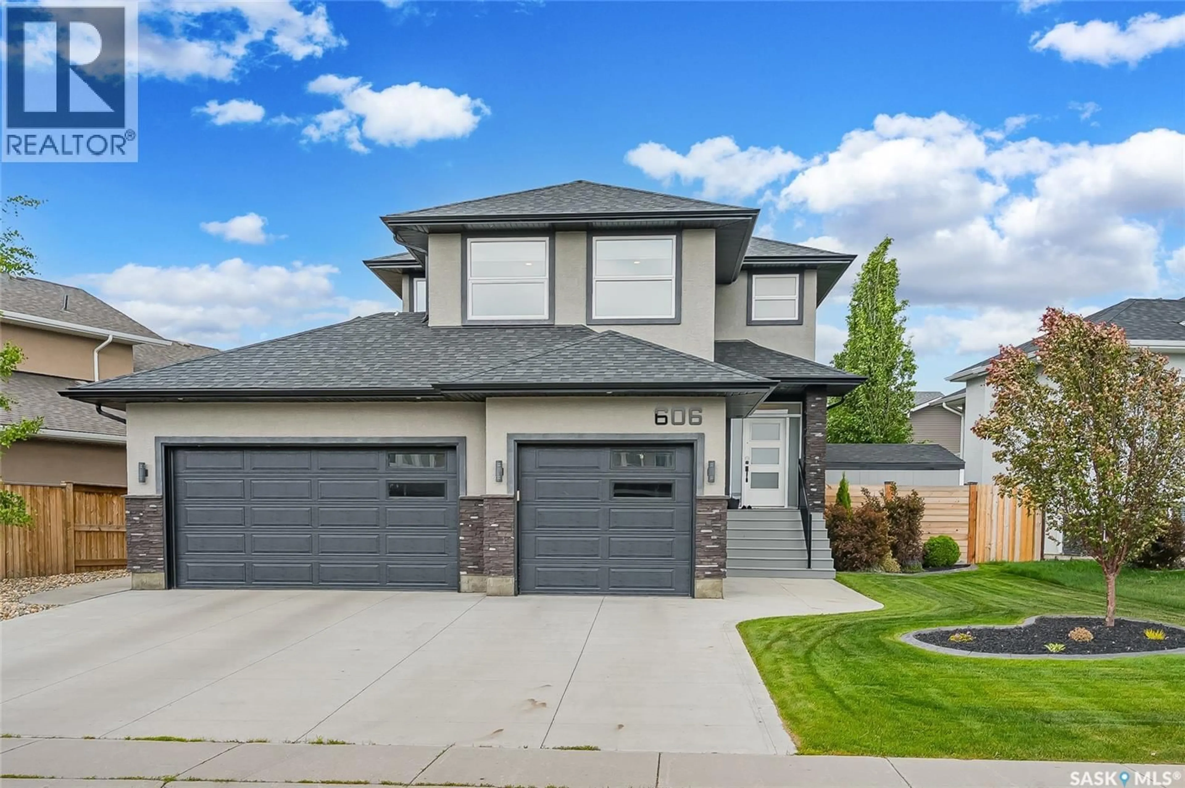 Home with vinyl exterior material, street for 606 PICHLER CRESCENT, Saskatoon Saskatchewan S7V0G2