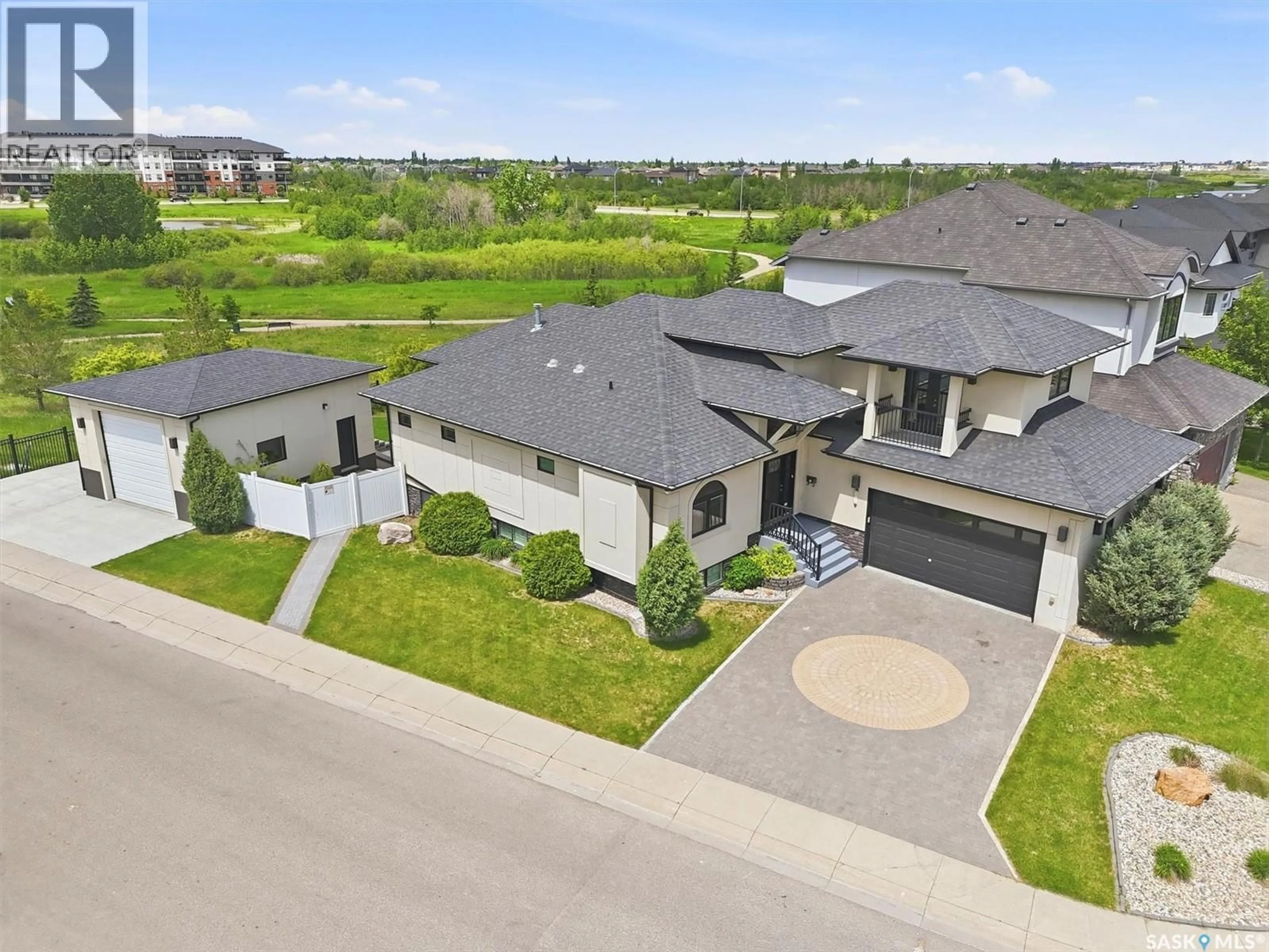 A pic from outside/outdoor area/front of a property/back of a property/a pic from drone, street for 327 HASTINGS LANE, Saskatoon Saskatchewan S7V0C8