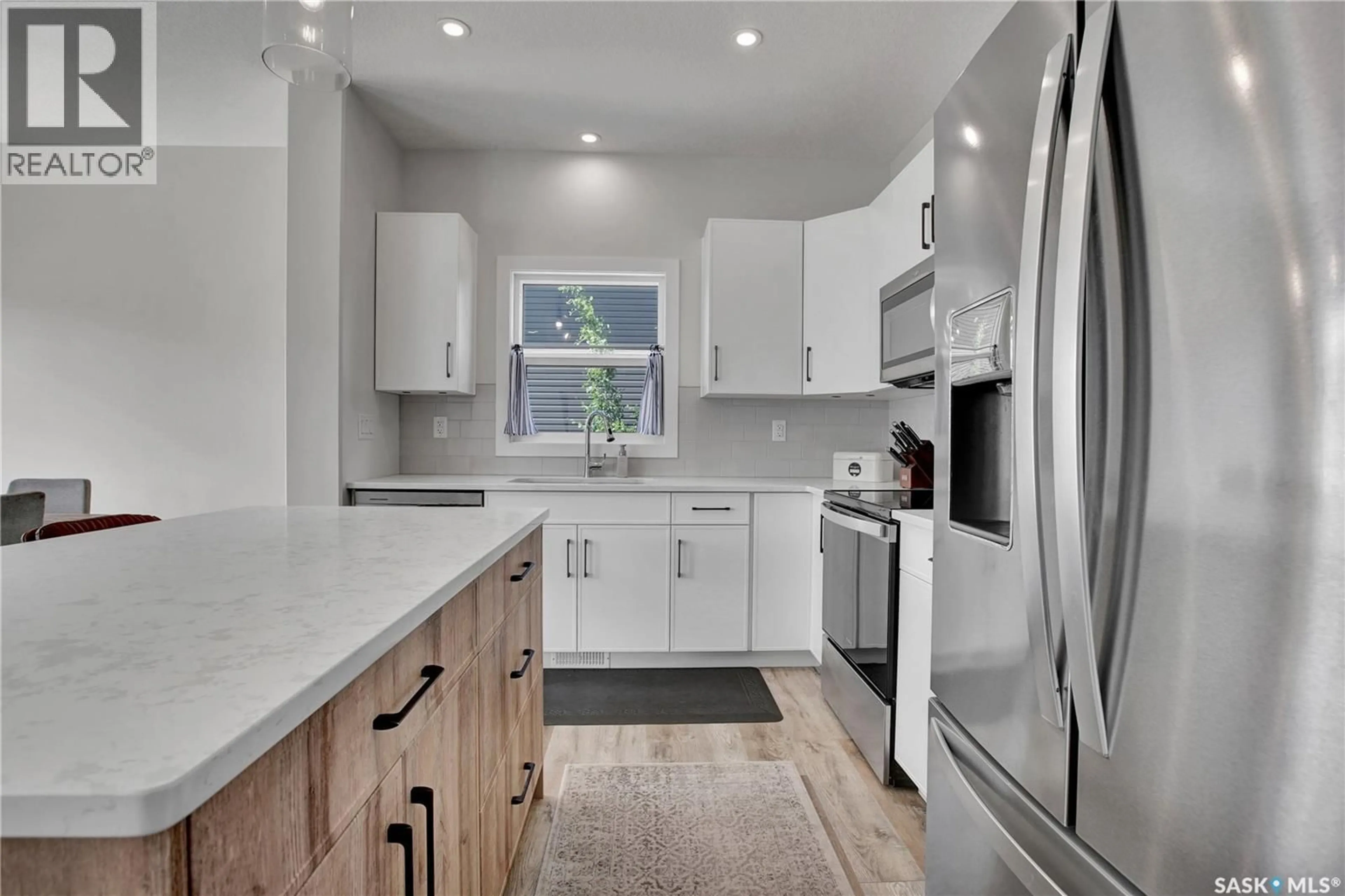 Open concept kitchen, ceramic/tile floor for 1312 PARR HILL DRIVE, Martensville Saskatchewan S0K2T1