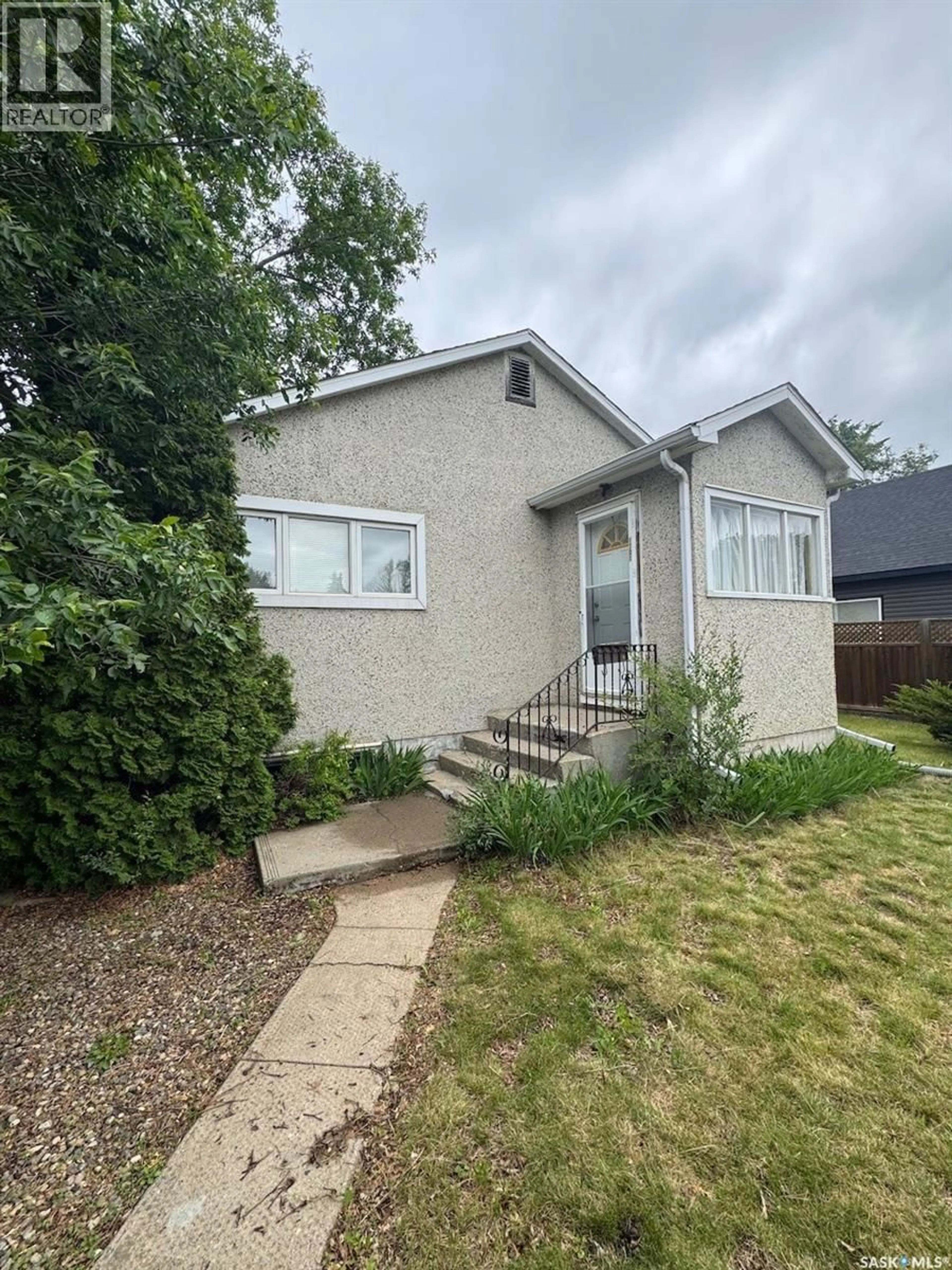 Home with vinyl exterior material, street for 1301 107TH STREET, North Battleford Saskatchewan S9A1Z6