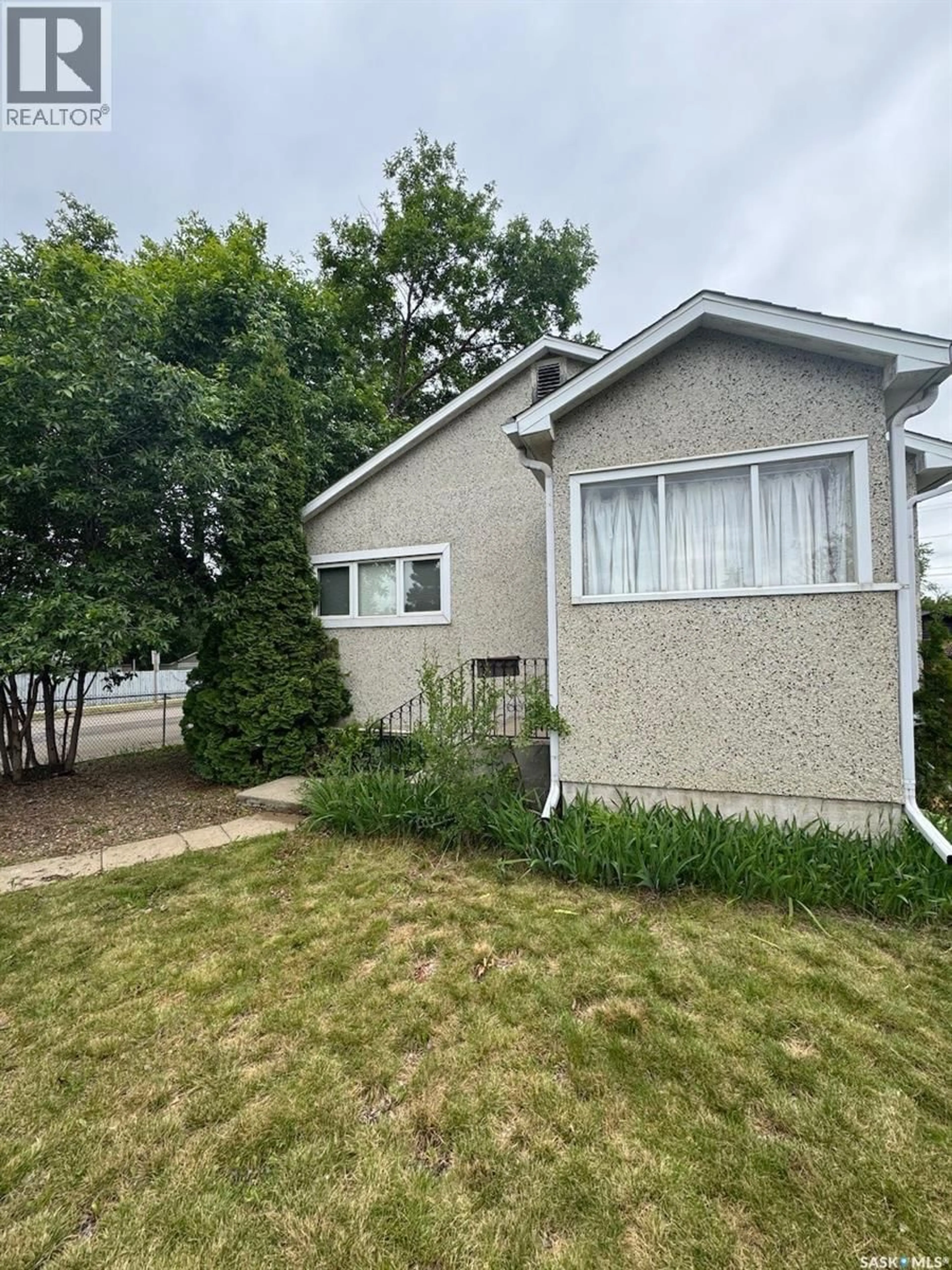 Home with vinyl exterior material, street for 1301 107TH STREET, North Battleford Saskatchewan S9A1Z6