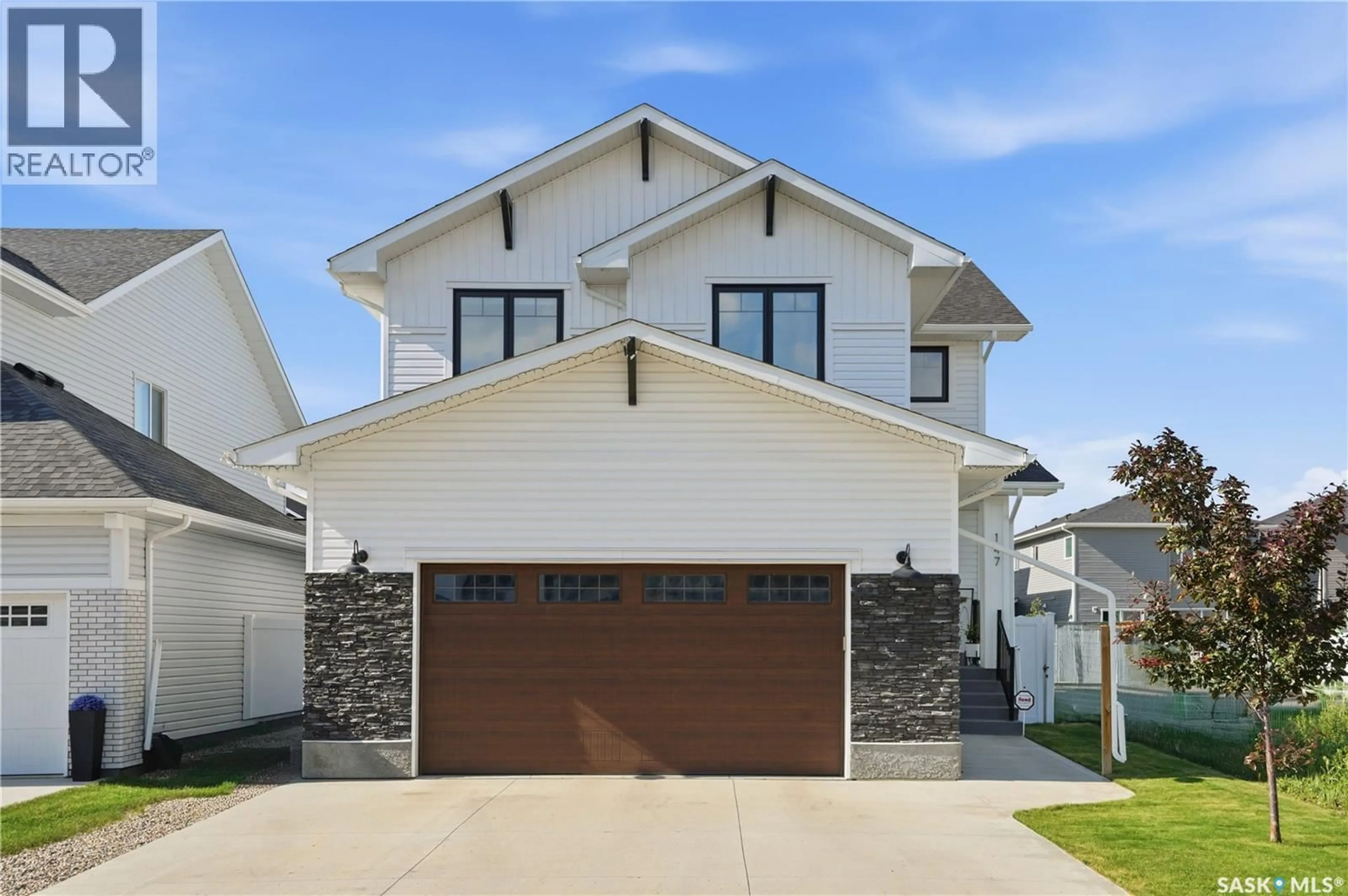 Home with vinyl exterior material, street for 147 BARRETT STREET, Saskatoon Saskatchewan S7W0Z8