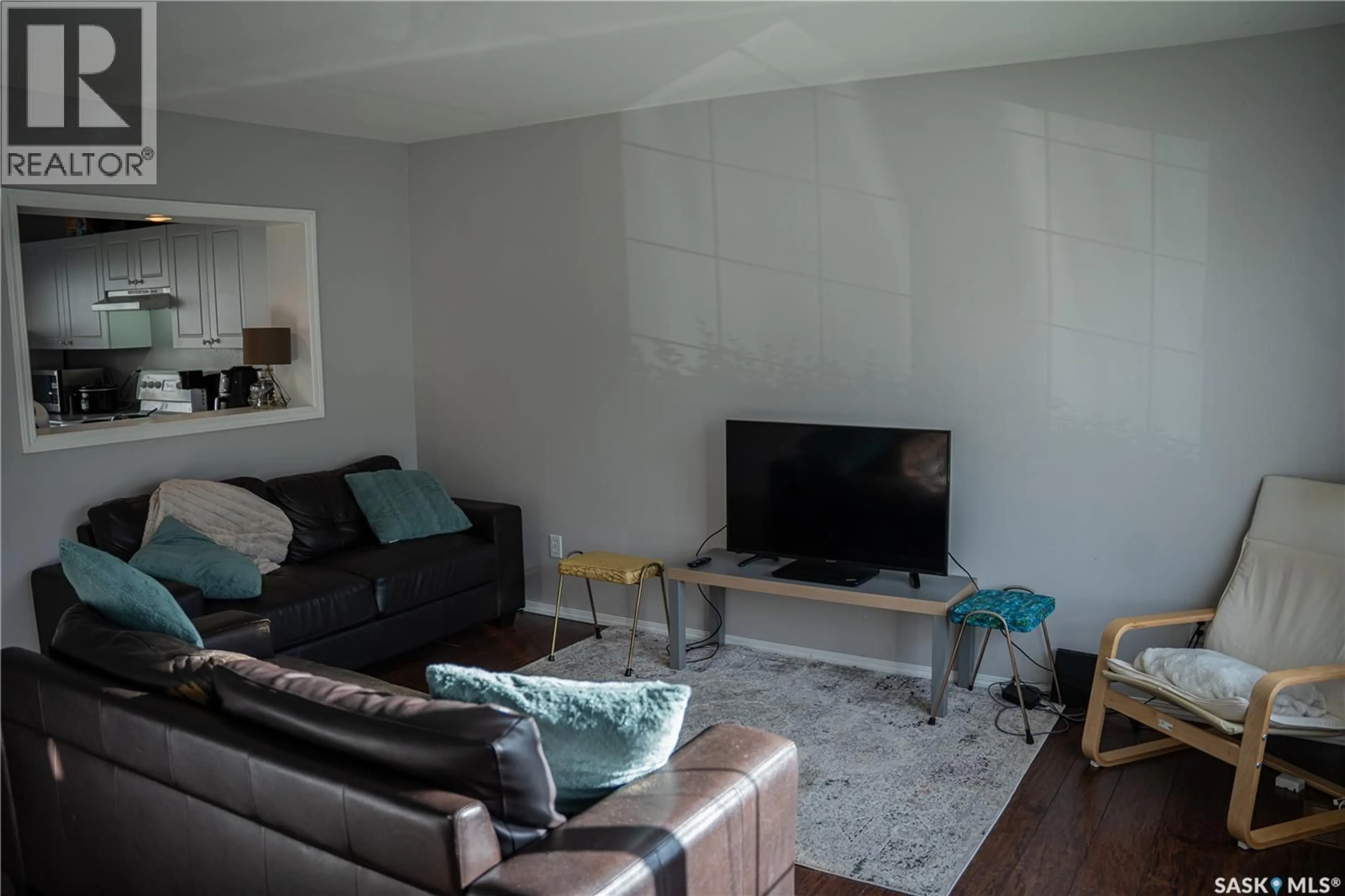Living room with furniture, wood/laminate floor for 663 - 106 BECKETT CRESCENT, Saskatoon Saskatchewan S7N4X2