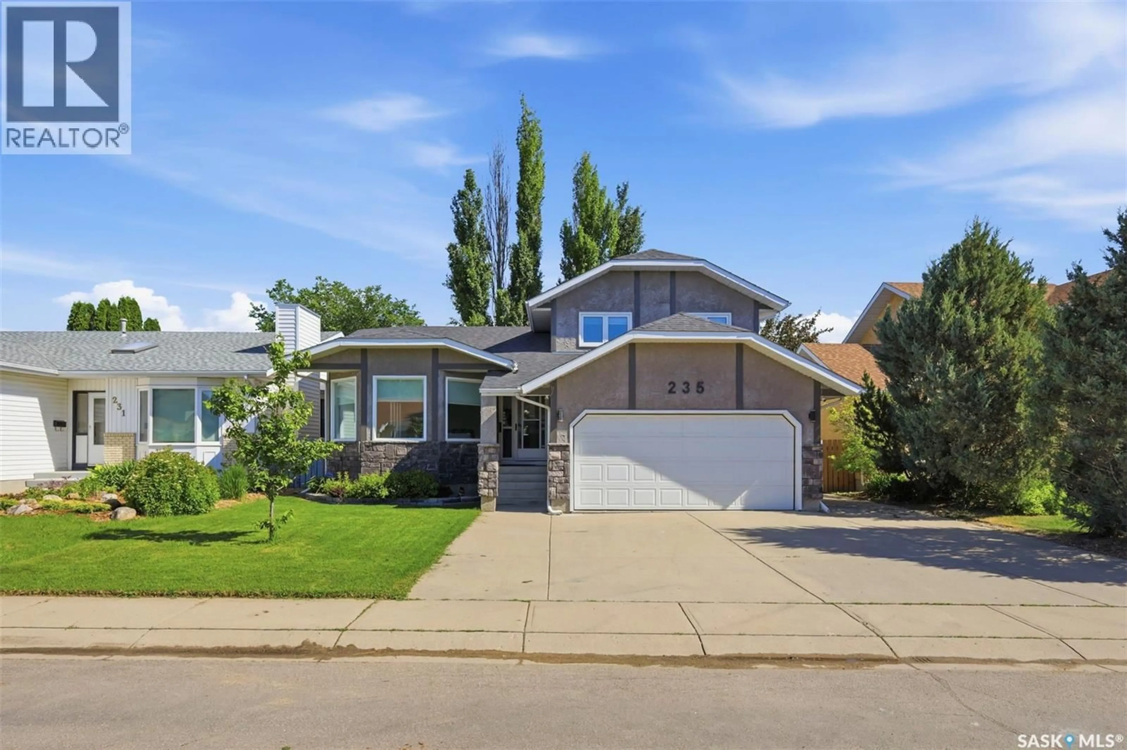 Home with vinyl exterior material, street for 235 BRONSON WAY, Saskatoon Saskatchewan S7J5E5