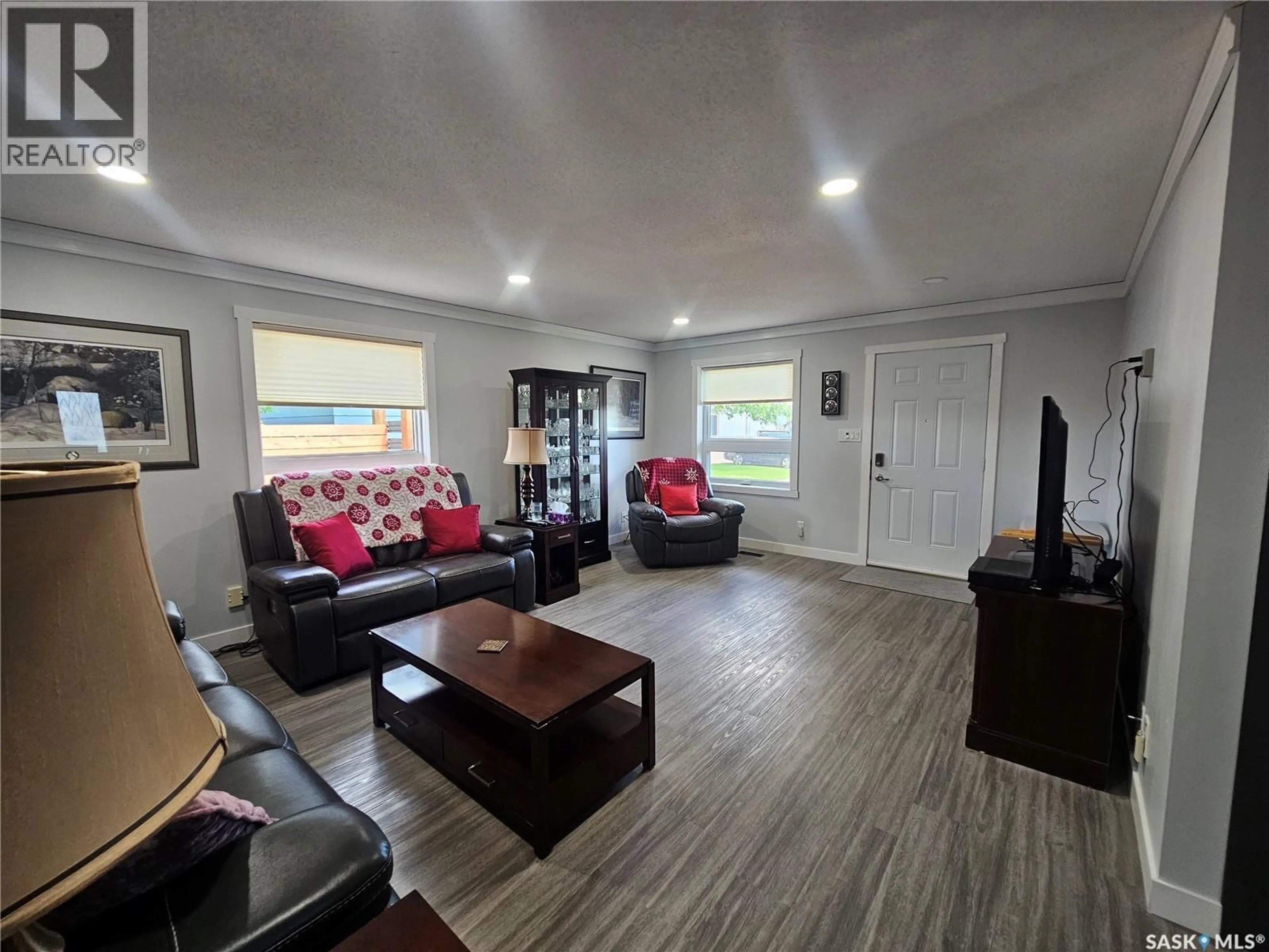 Living room with furniture, wood/laminate floor for 575 9TH STREET, Shaunavon Saskatchewan S0N2M0