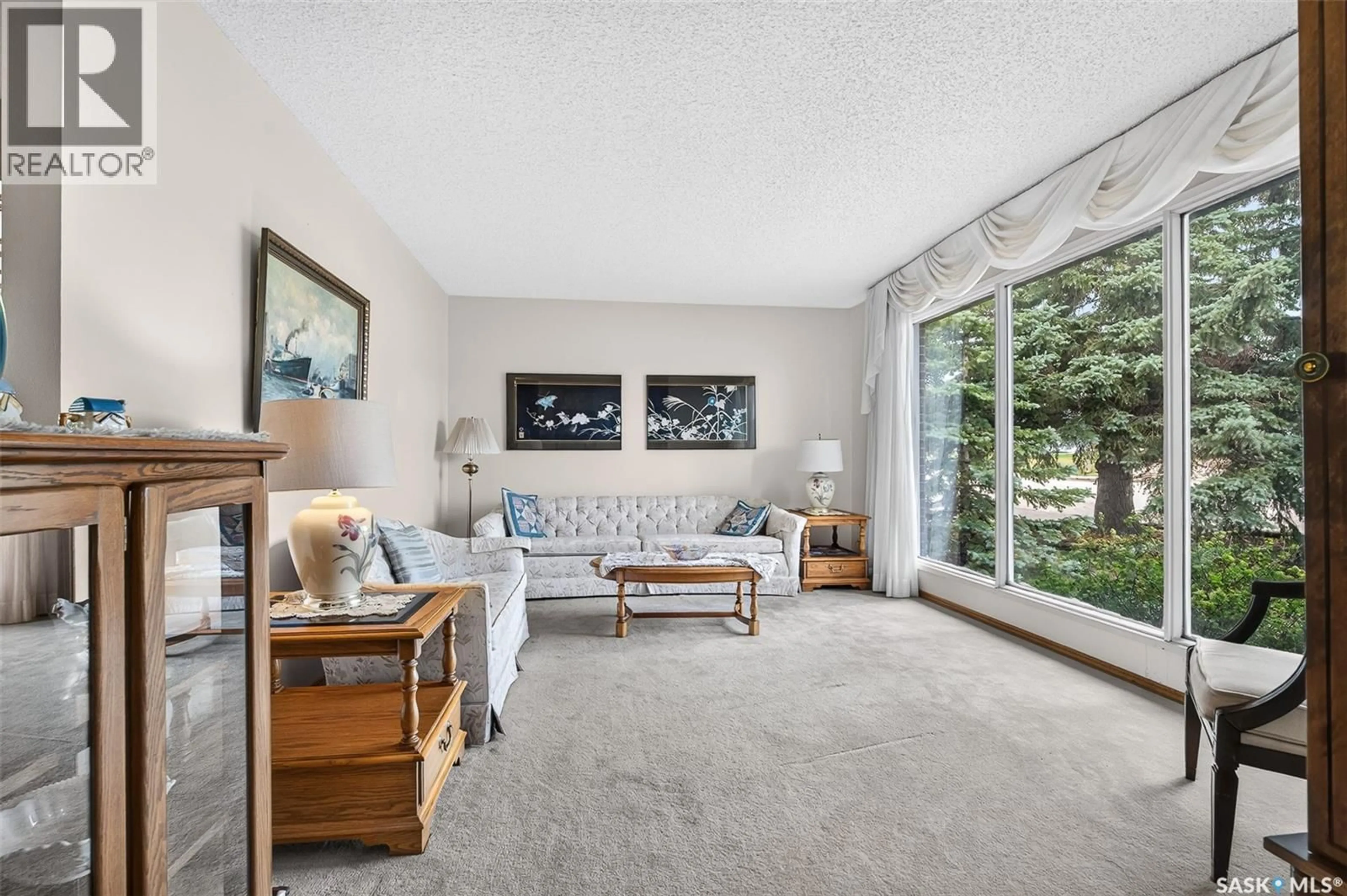 Living room with furniture, carpet floor for 1343 STADACONA STREET, Moose Jaw Saskatchewan S6H6L4