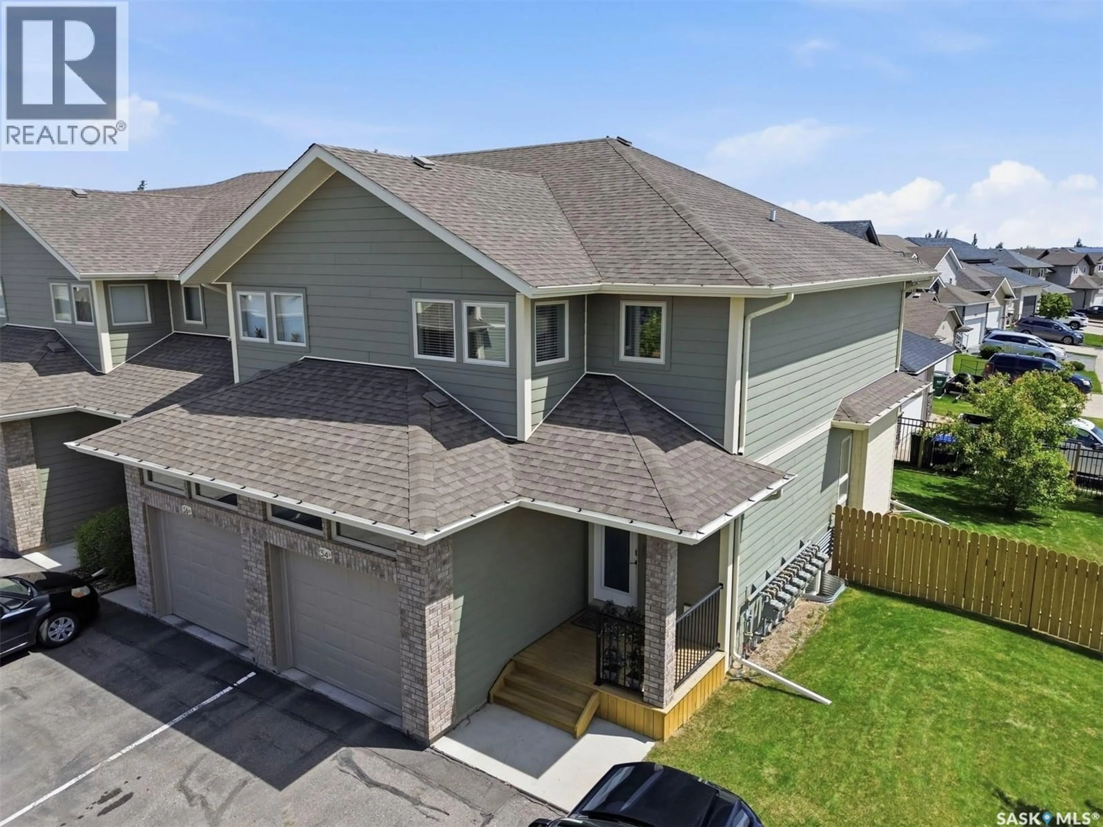 A pic from outside/outdoor area/front of a property/back of a property/a pic from drone, unknown for 34 1550 PATON CRESCENT, Saskatoon Saskatchewan S7T0J1