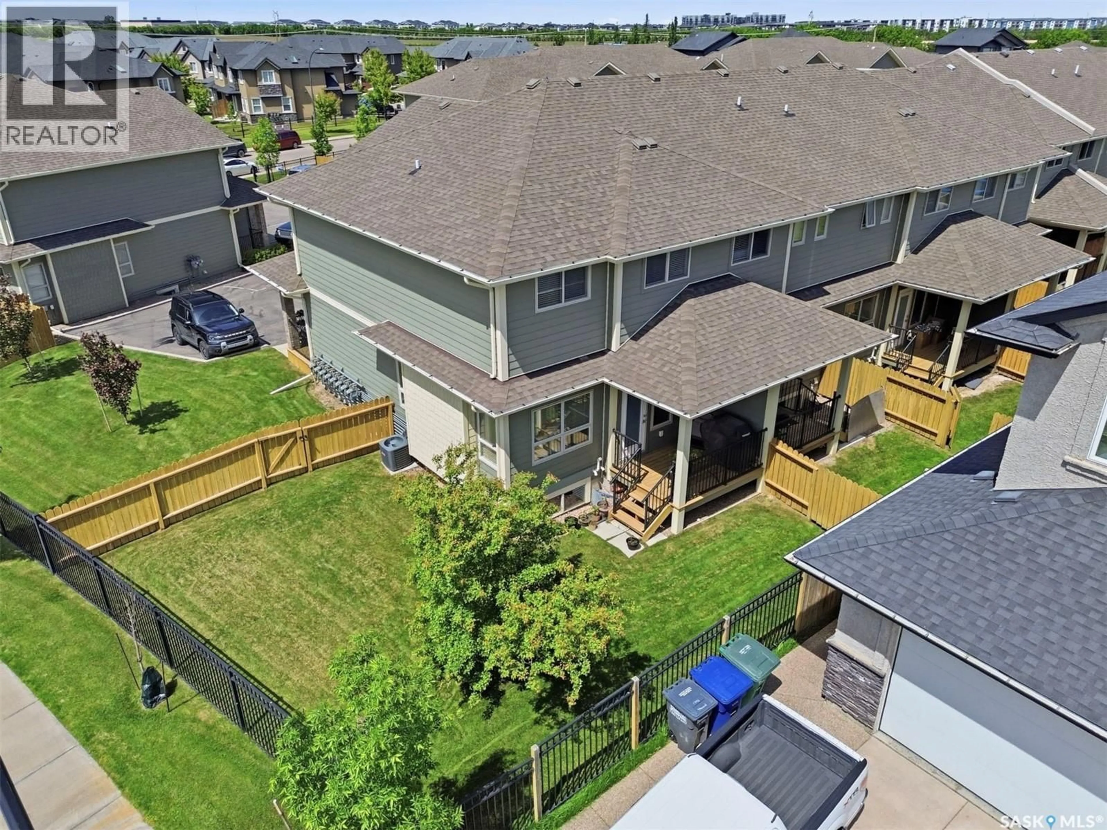 A pic from outside/outdoor area/front of a property/back of a property/a pic from drone, unknown for 34 1550 PATON CRESCENT, Saskatoon Saskatchewan S7T0J1