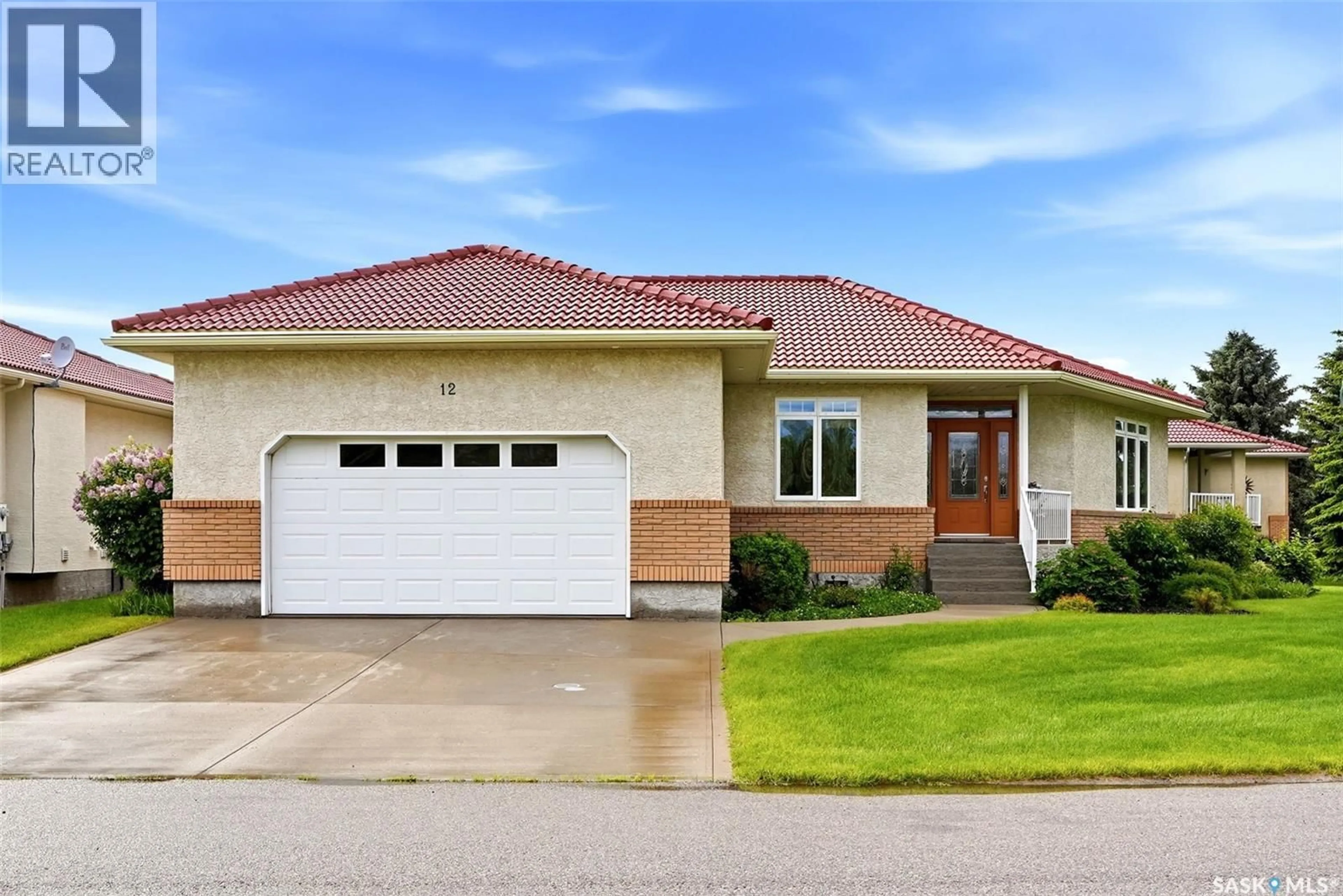 Home with vinyl exterior material, street for 12 ST ANDREWS BAY, Edenwold Rm No.158 Saskatchewan S4L1A2