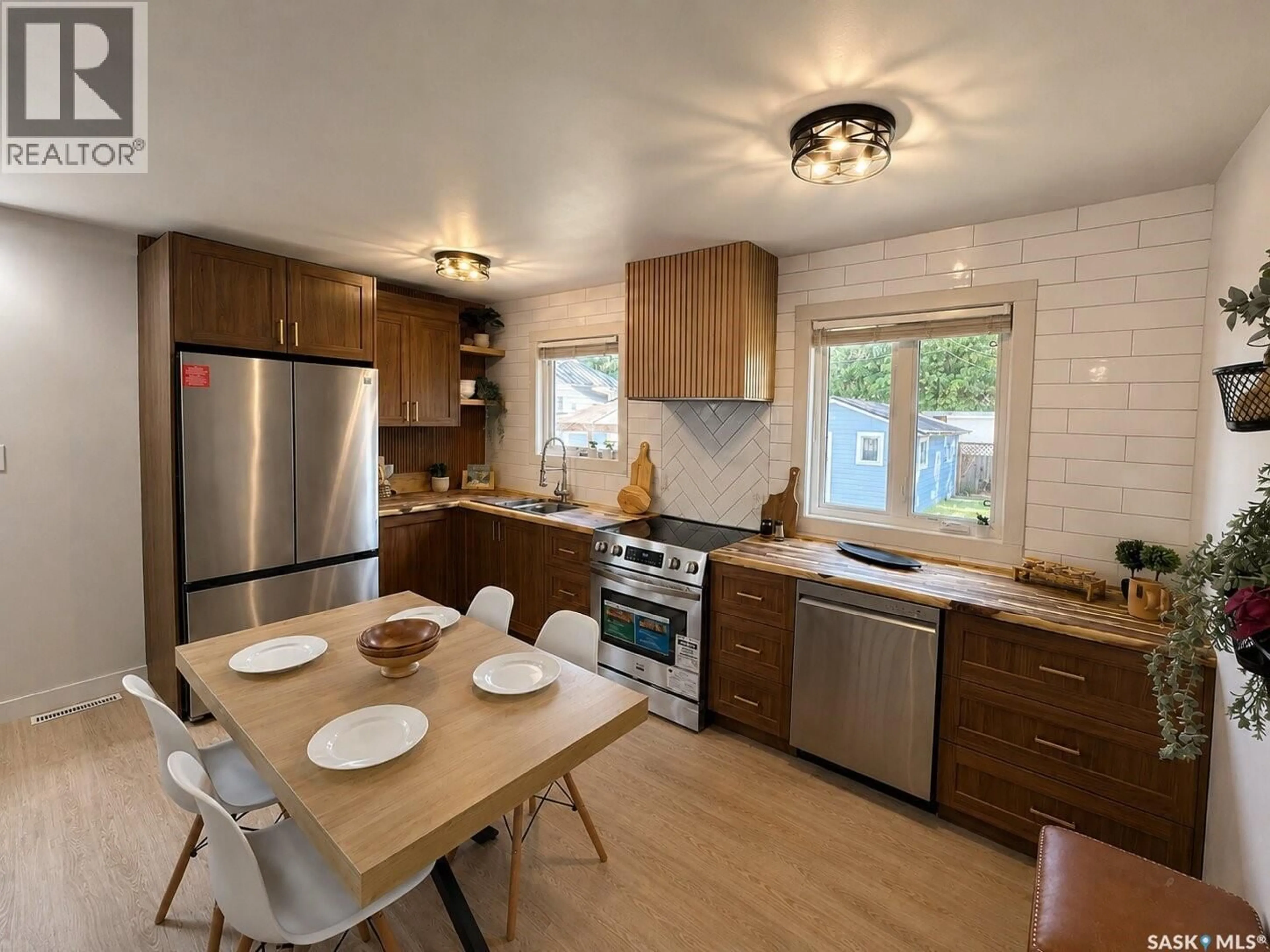 Open concept kitchen, wood/laminate floor for 3015 5TH STREET, Rosthern Saskatchewan S0K3R0