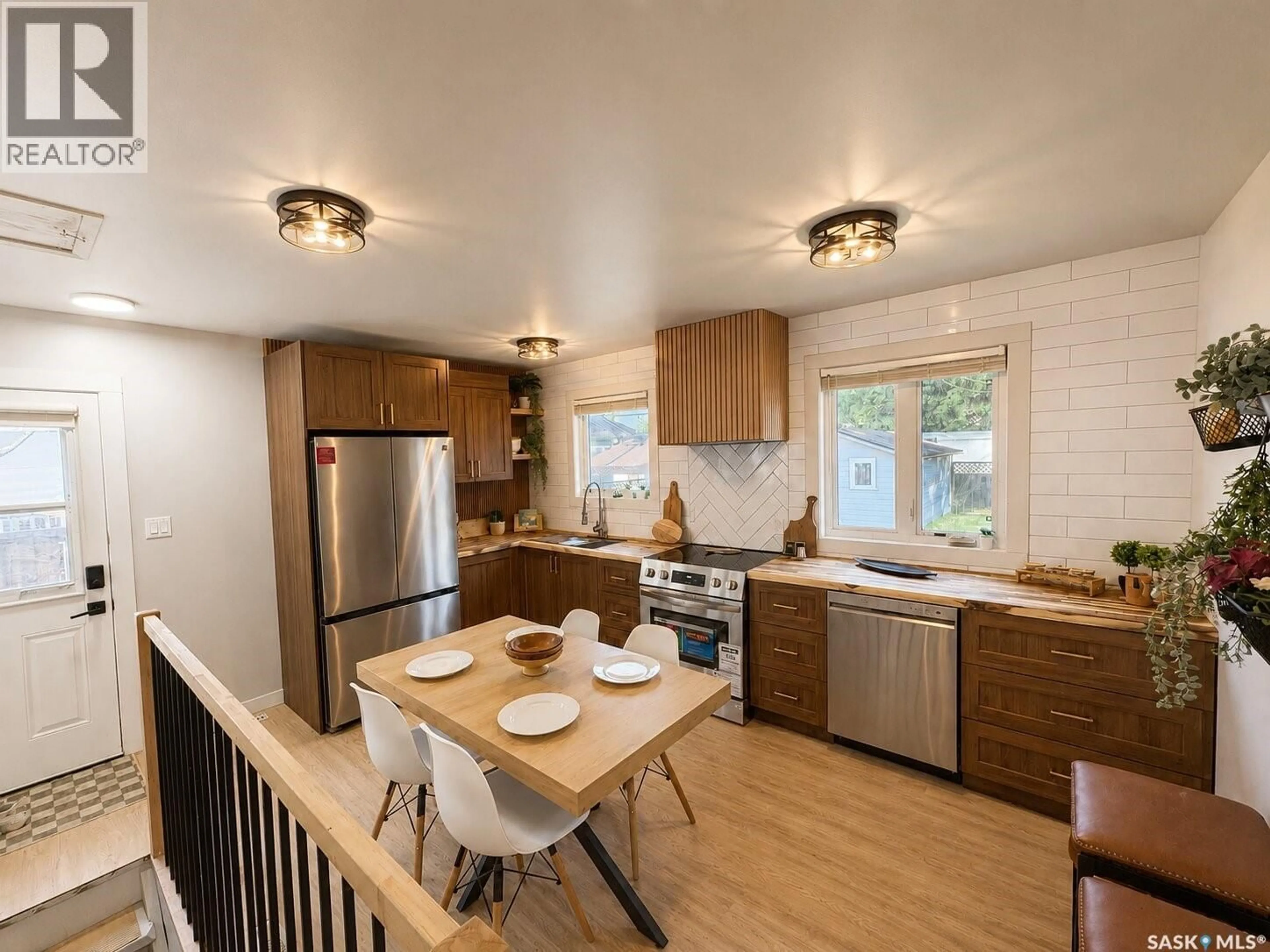 Open concept kitchen, wood/laminate floor for 3015 5TH STREET, Rosthern Saskatchewan S0K3R0