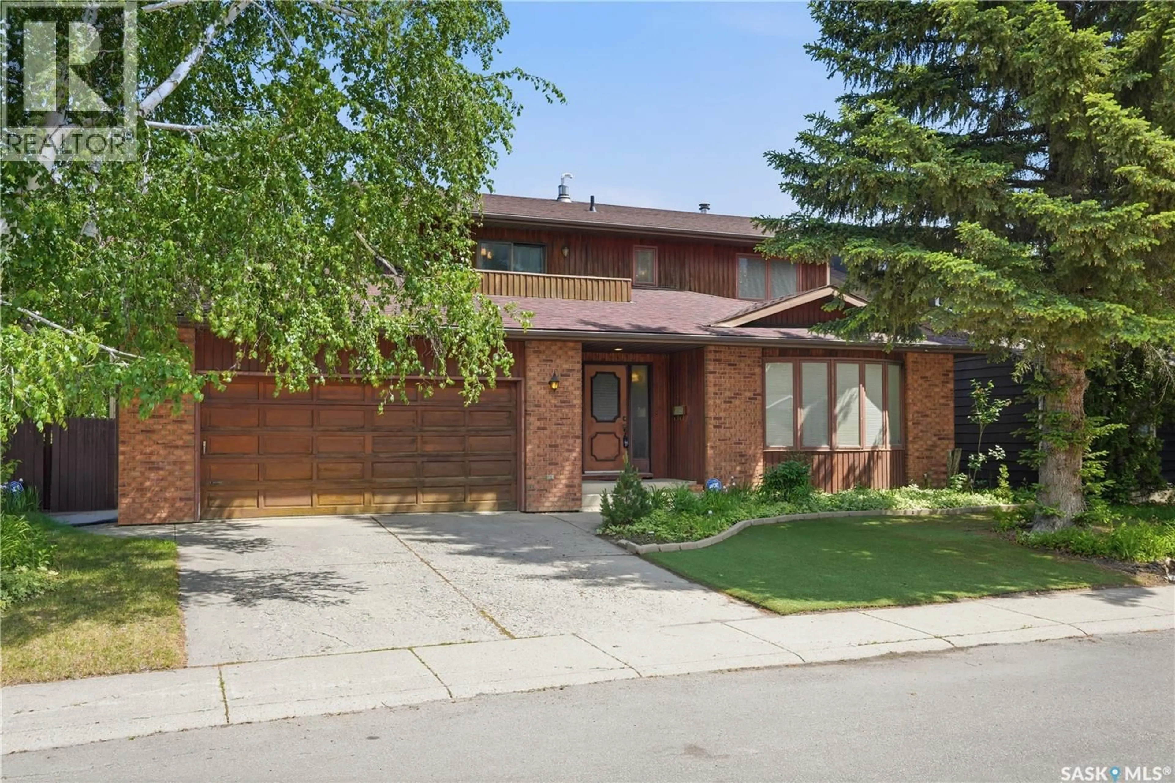 Home with brick exterior material, street for 211 KEELEY CRESCENT, Saskatoon Saskatchewan S7J4B9