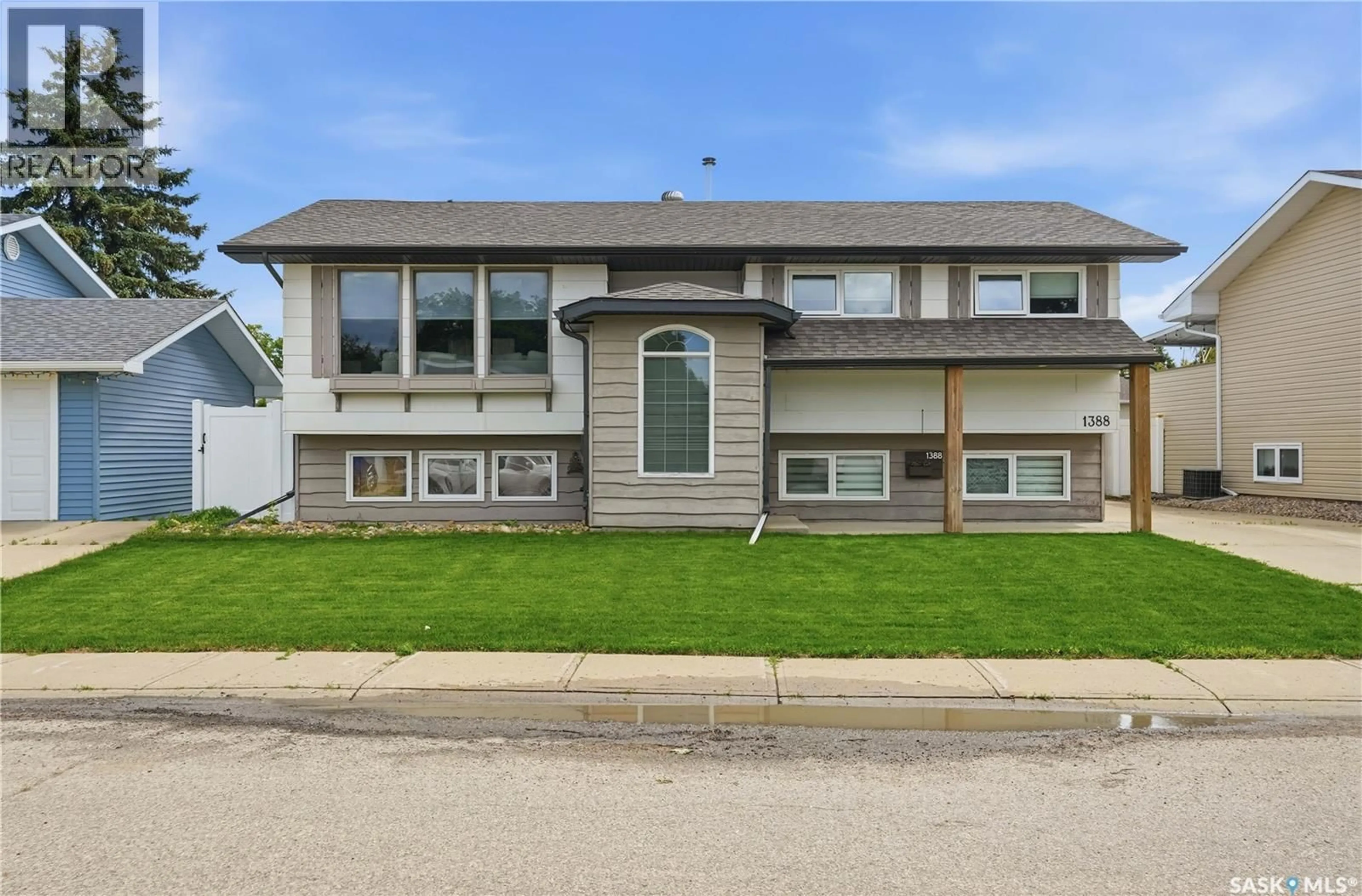 Home with vinyl exterior material, street for 1388 PRINCE CRESCENT, Moose Jaw Saskatchewan S6H6E5