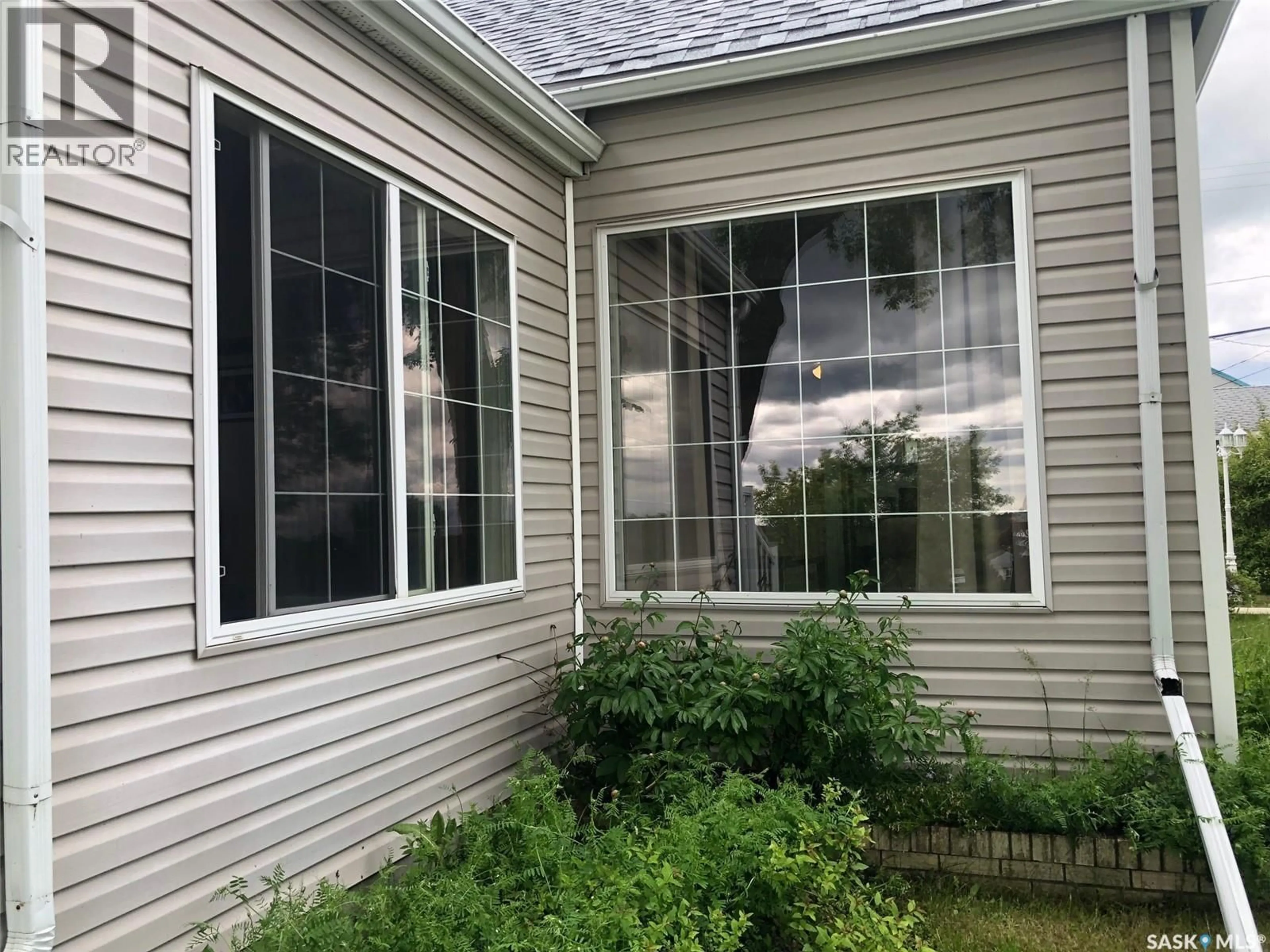 Home with vinyl exterior material, street for E - 48 HIGHWAY AVENUE, Preeceville Saskatchewan S0A3B0