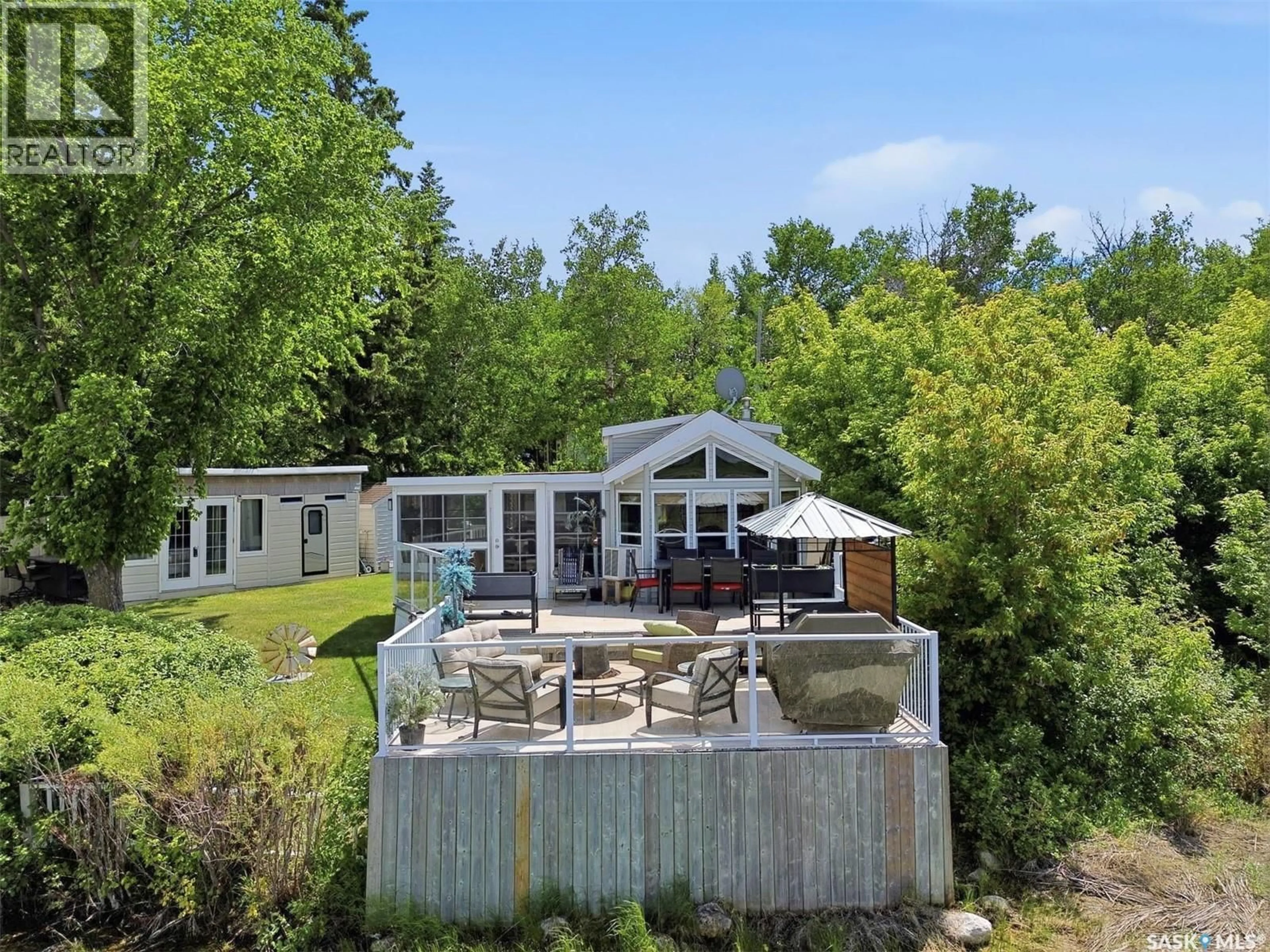 A pic from outside/outdoor area/front of a property/back of a property/a pic from drone, water/lake/river/ocean view for 71 POPLAR BEACH, Wakaw Lake Saskatchewan S0K4P0