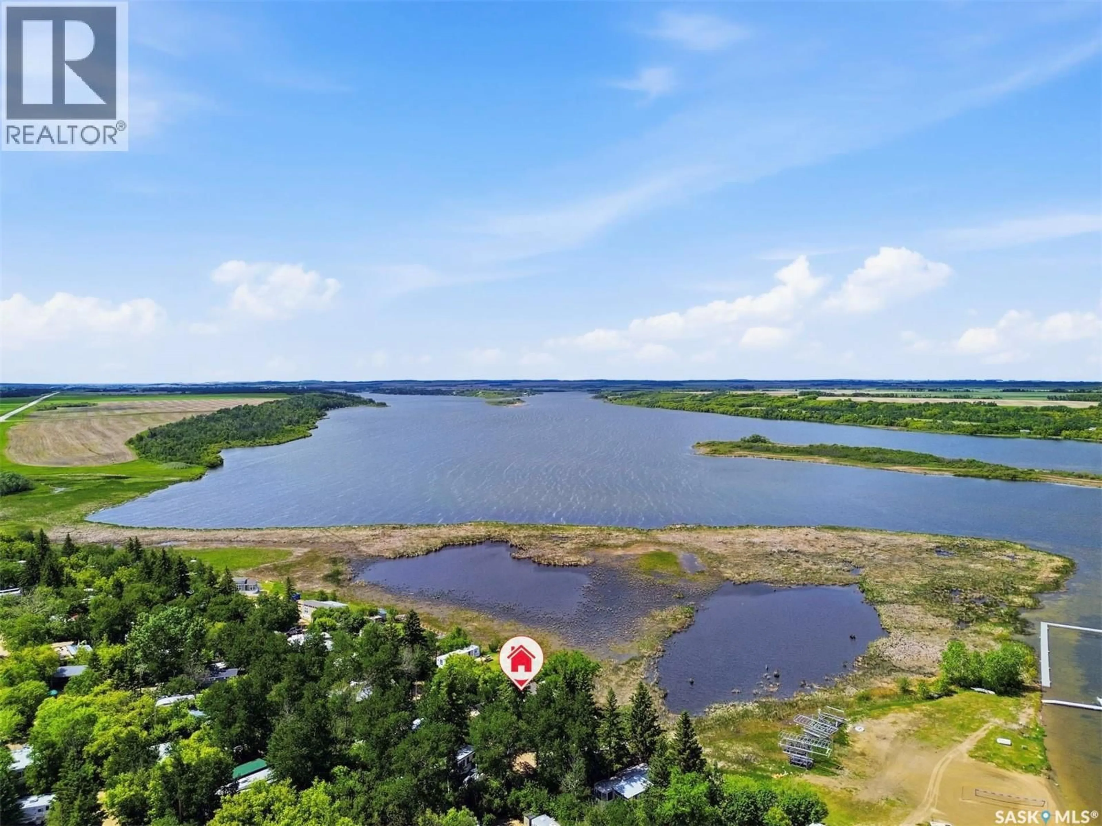 A pic from outside/outdoor area/front of a property/back of a property/a pic from drone, water/lake/river/ocean view for 71 POPLAR BEACH, Wakaw Lake Saskatchewan S0K4P0