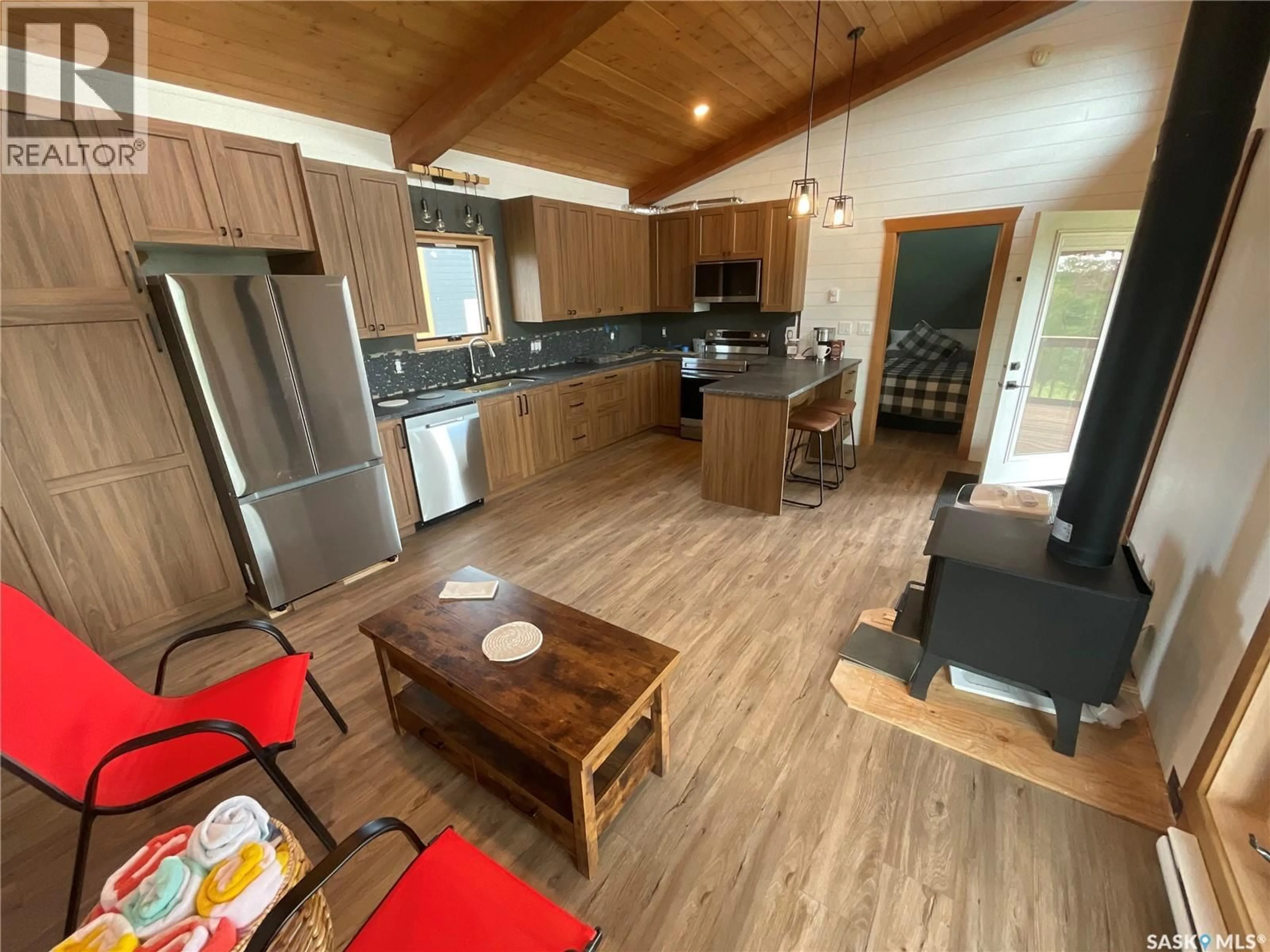Open concept kitchen, wood/laminate floor for 3 WACASA RIDGE, Hoodoo Rm No. 401 Saskatchewan S0K4P0