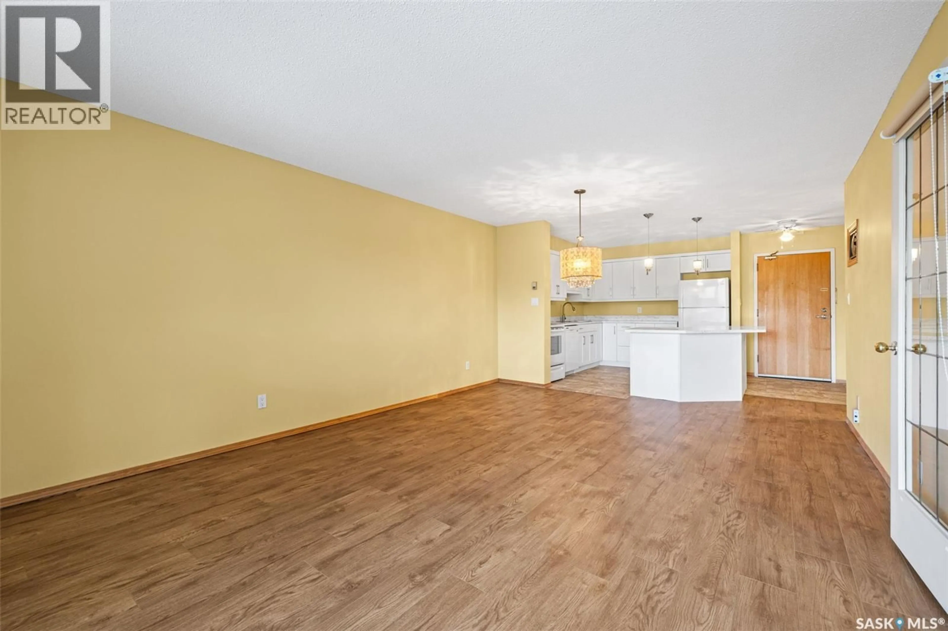 Open concept kitchen, wood/laminate floor for 329 960 ASSINIBOINE AVENUE, Regina Saskatchewan S4V2P8