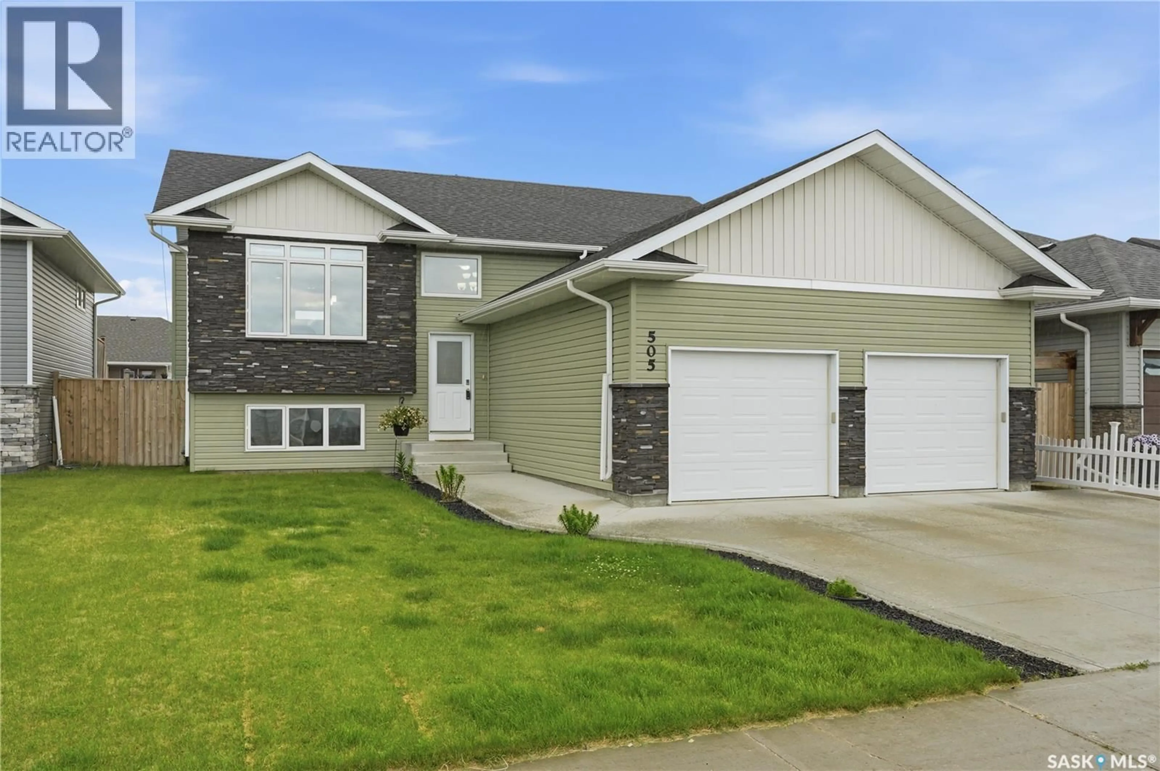 Home with vinyl exterior material, street for 505 MICKELSON LANE, Warman Saskatchewan S0K4S1