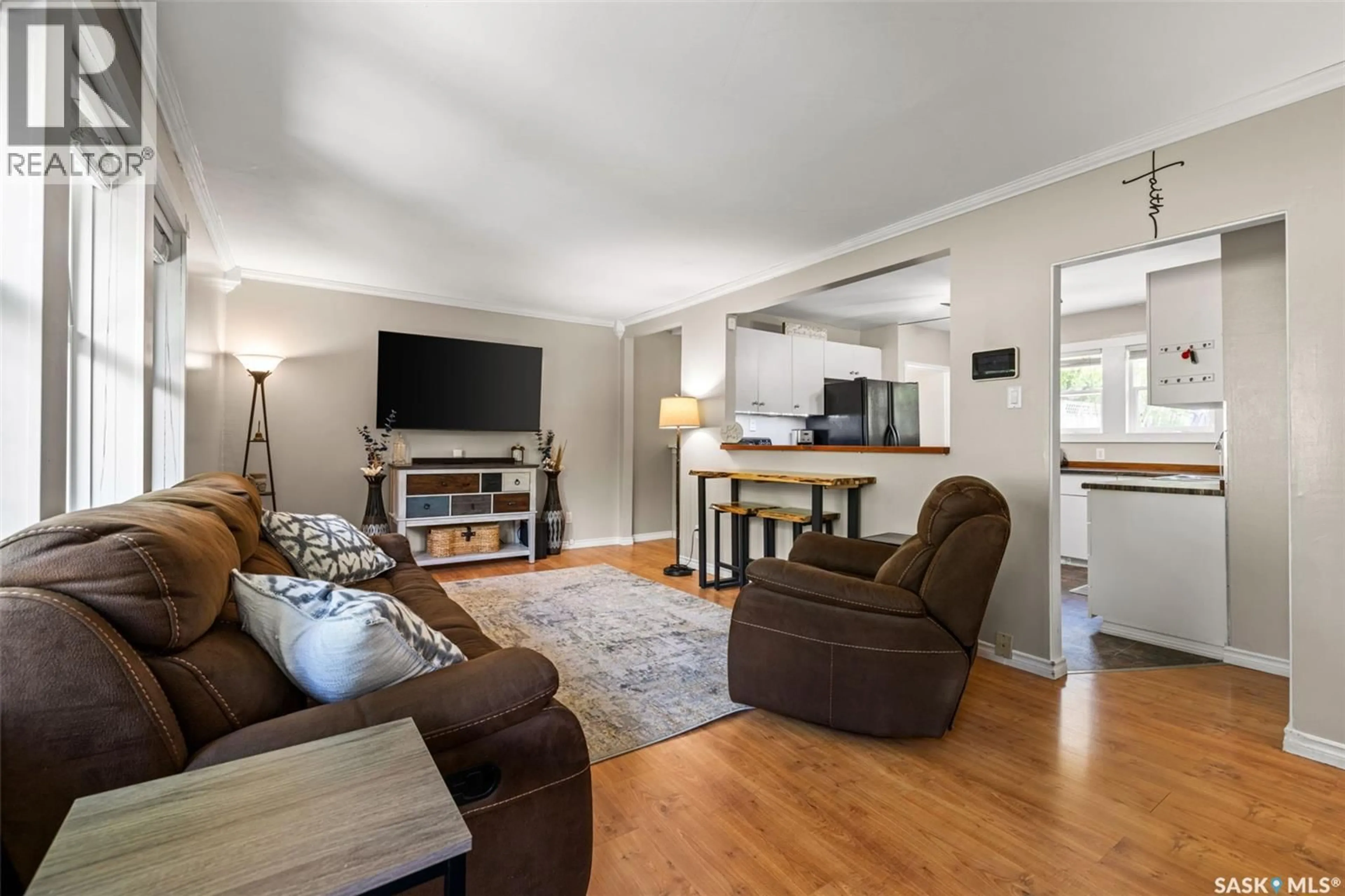 Living room with furniture, wood/laminate floor for 95 QU'APPELLE DRIVE, Lumsden Saskatchewan S0G3C0