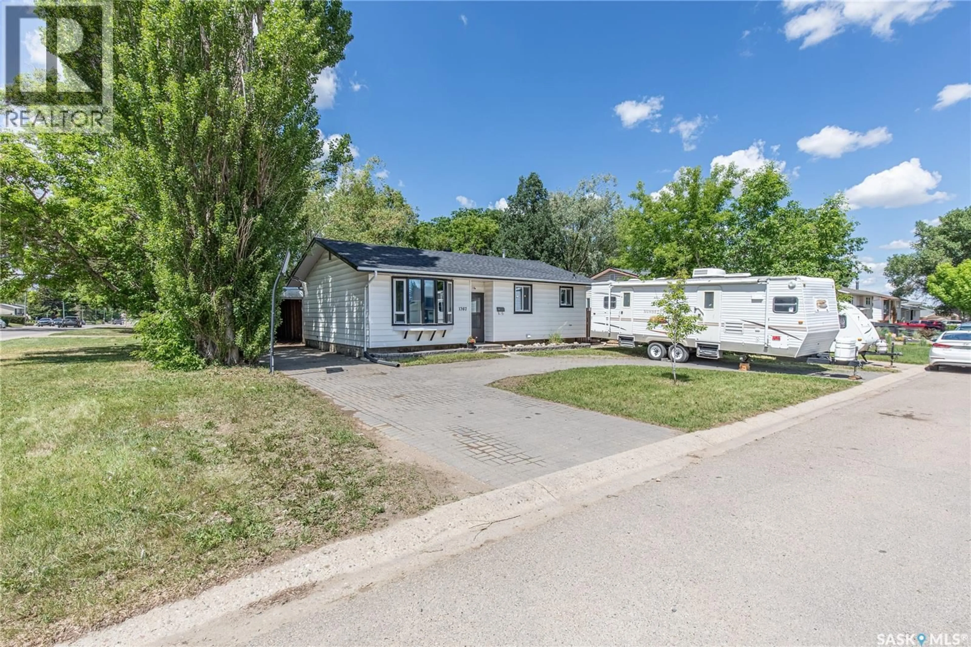 A pic from outside/outdoor area/front of a property/back of a property/a pic from drone, street for 1387 MANITOU CRESCENT, Moose Jaw Saskatchewan S6H7C5