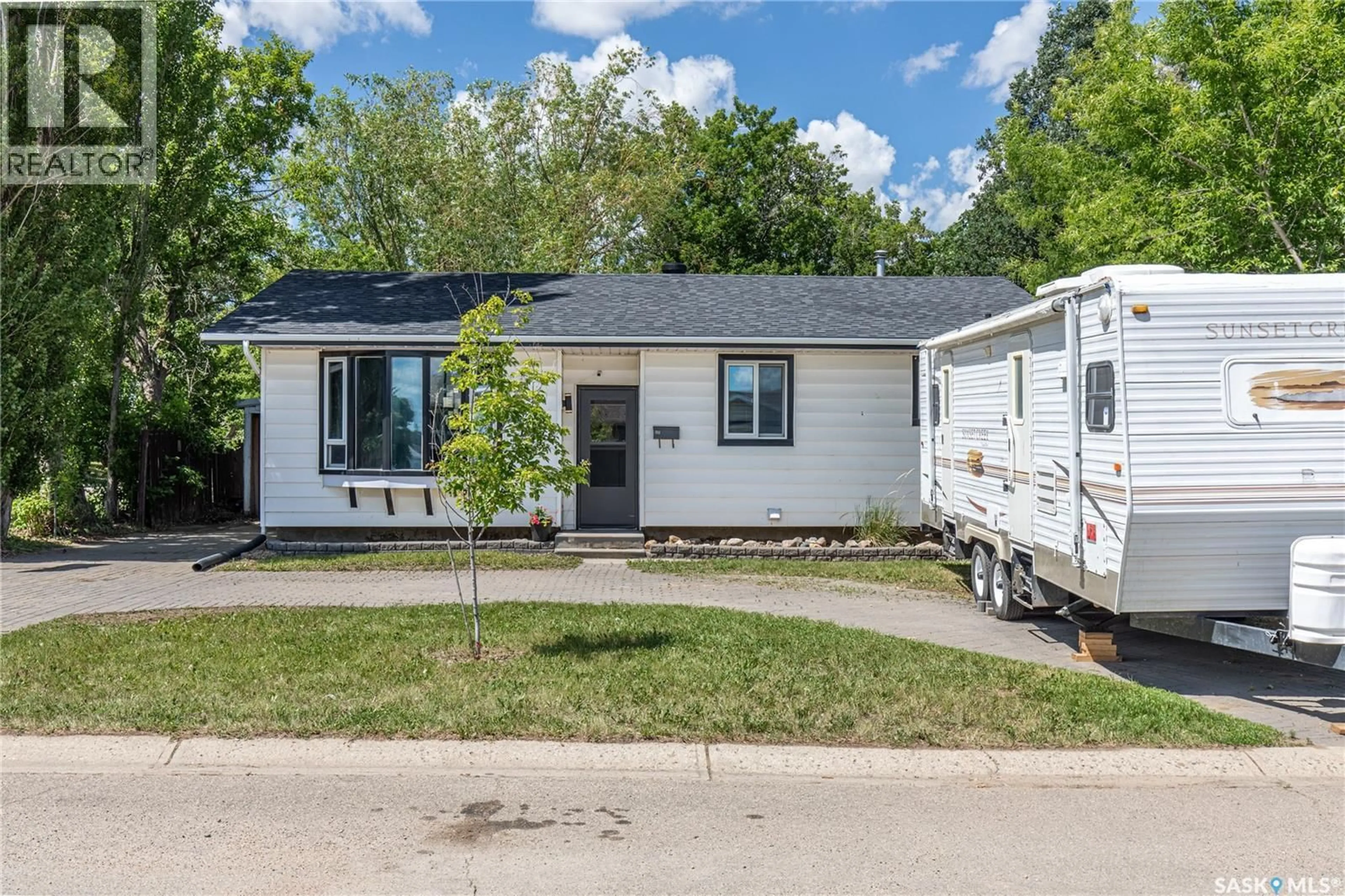 Home with vinyl exterior material, street for 1387 MANITOU CRESCENT, Moose Jaw Saskatchewan S6H7C5