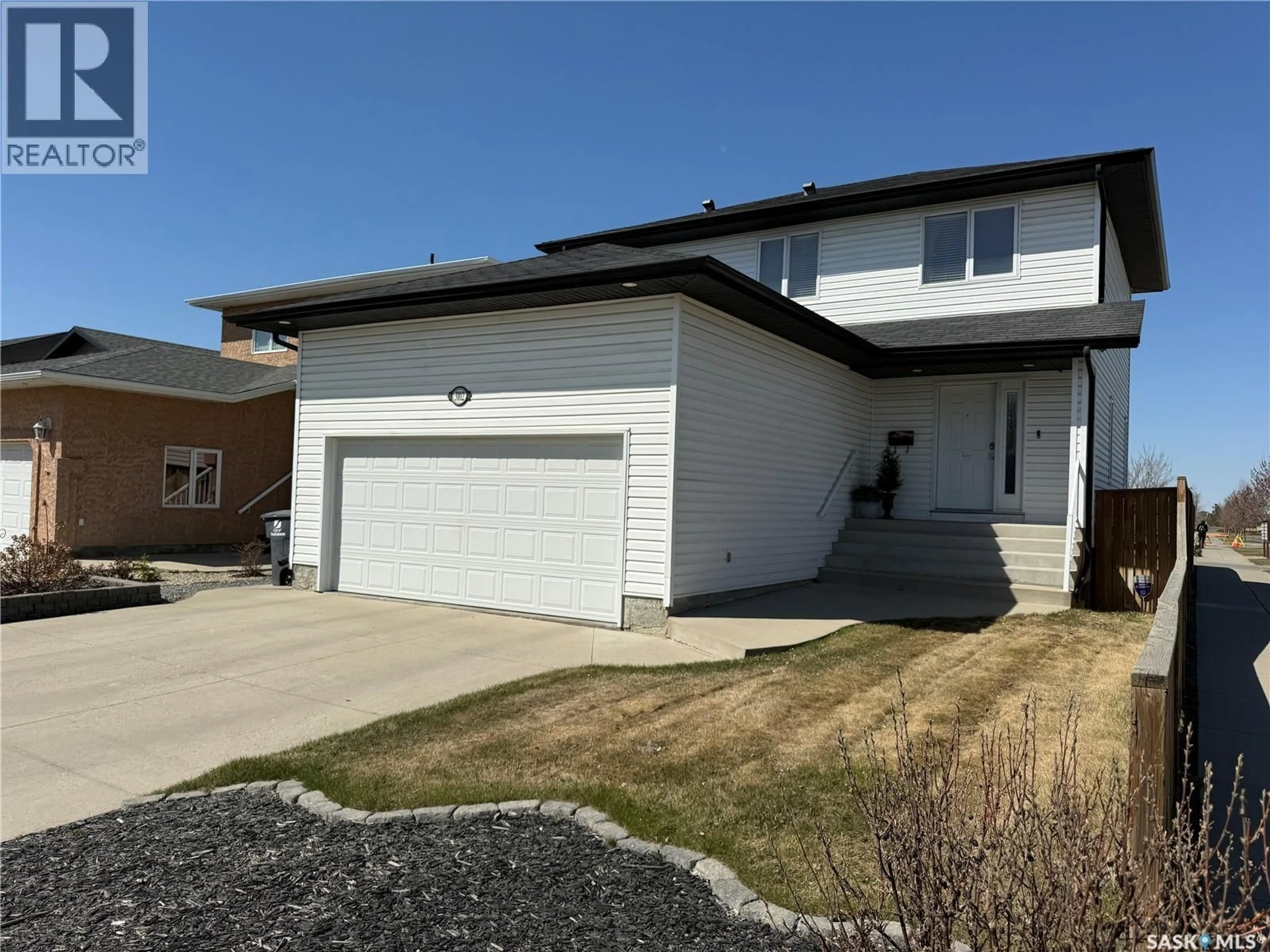Home with vinyl exterior material, street for 3102 37TH STREET, Saskatoon Saskatchewan S7L7H9