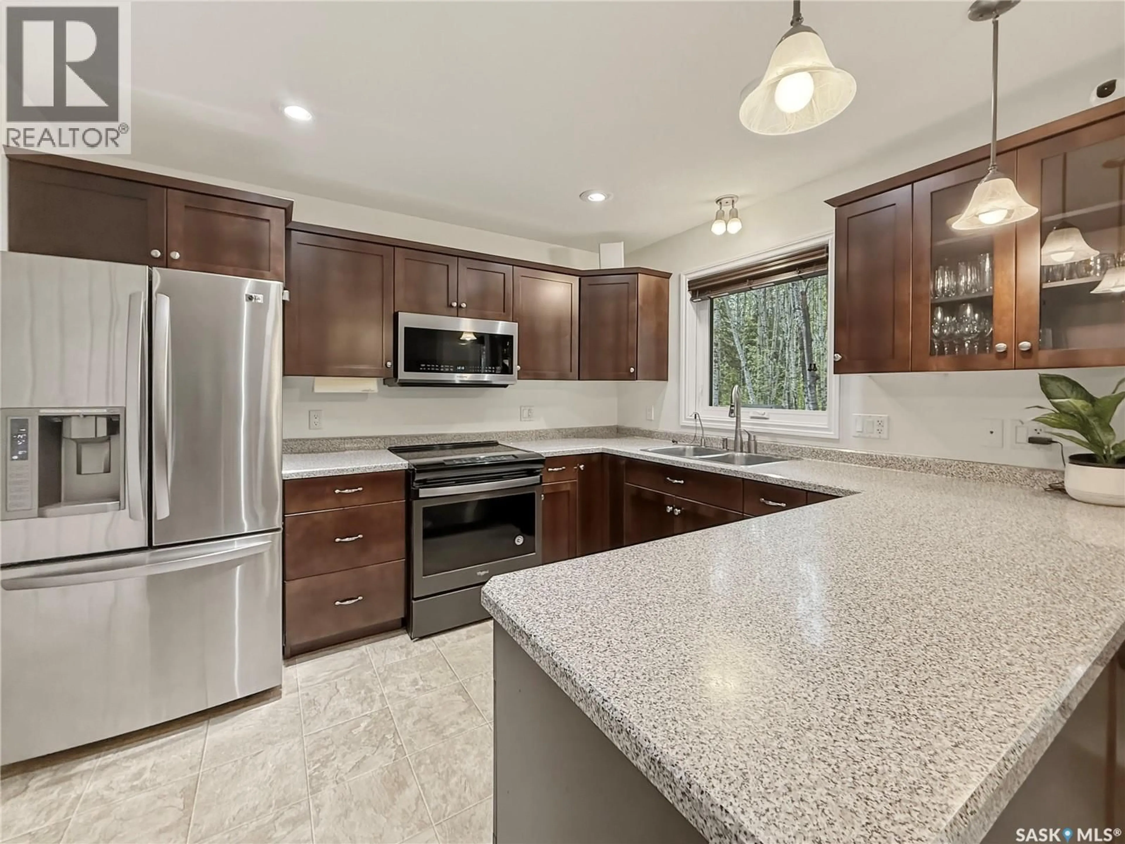 Open concept kitchen, ceramic/tile floor for 205 ASPEN RIDGE ROAD, Candle Lake Saskatchewan S0J3E0