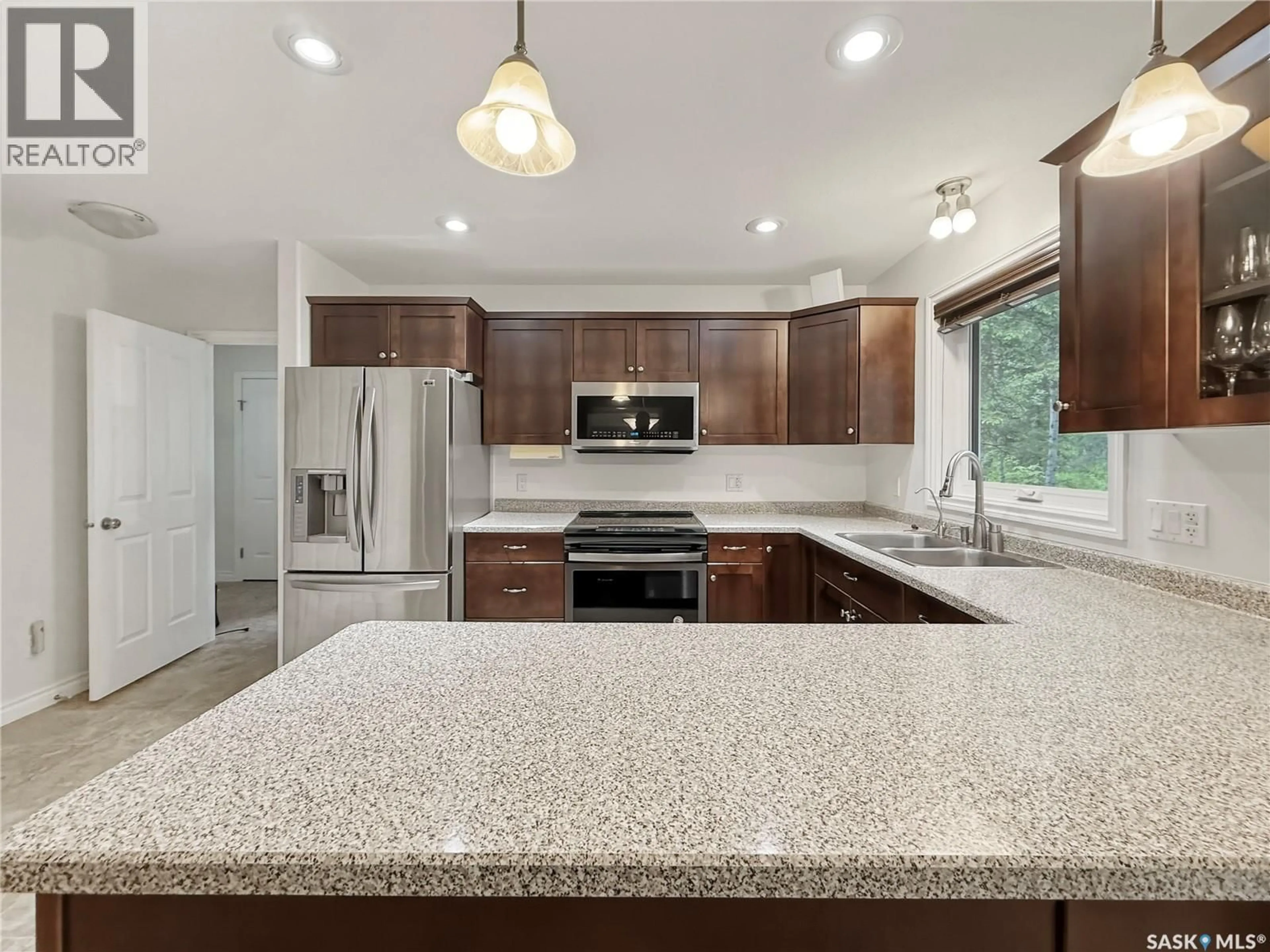 Open concept kitchen, ceramic/tile floor for 205 ASPEN RIDGE ROAD, Candle Lake Saskatchewan S0J3E0